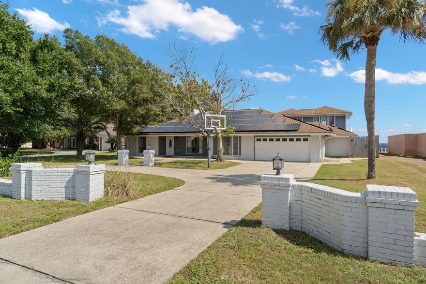 Experience breathtaking bayfront living at 5 Country Club Rd in Shalimar, FL. This 3,894 sq ft residence rests on .60 acres with elevation that offers water views from three of the 6 bedrooms--including a loft-style suite flexible for a home office or retreat with its own entrance. Enjoy sunrise mornings maybe with coffee or pool deck work out. Views of Fort Walton Beach, Destin, and Sandestin fireworks during the 4th of July over the bay view. As you approach the dock, a private beach-like area invites you to wade into the bay before reaching your dock--perfect for jet skis or a pontoon. A sparkling pool with Baja shelf, plenty of outdoor space with flexible interiors make this home a rare blend of luxury, comfort, and Emerald Coast serenity.Put this one on the list to see in person.