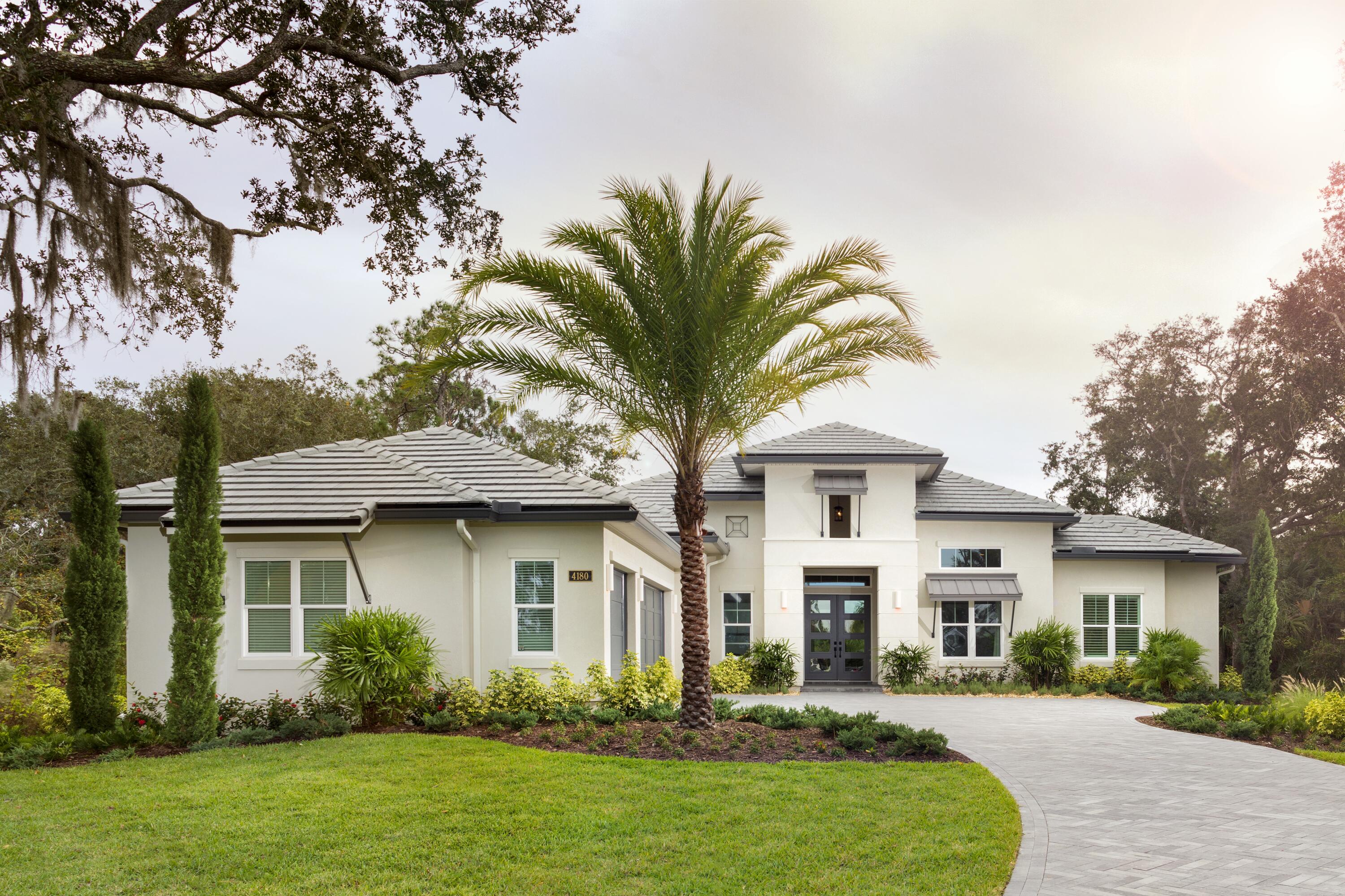 Ease into the abundant feeling of living in the natural beauty of the gated community of Trieste. This expansive home is a retreat from the ordinary. Great room and casual dining room open to the outdoor living area with sliding glass doors. Ceiling detail in the great room features decorative beams. The owner's suite entry has a vaulted ceiling and the foyer, owner's suite, and owner's bath have recessed ceilings. The Kitchen has a large center island with a seating bar, a hidden walk-in pantry, and is open to the casual dining room and great room. Dual vanities, a freestanding tub, an extra large walk-in shower, private water closet and two large walk-in closets in owner's suite.Lot clearing extra fill dirt or foundation are not included in this price, pool is an addition.