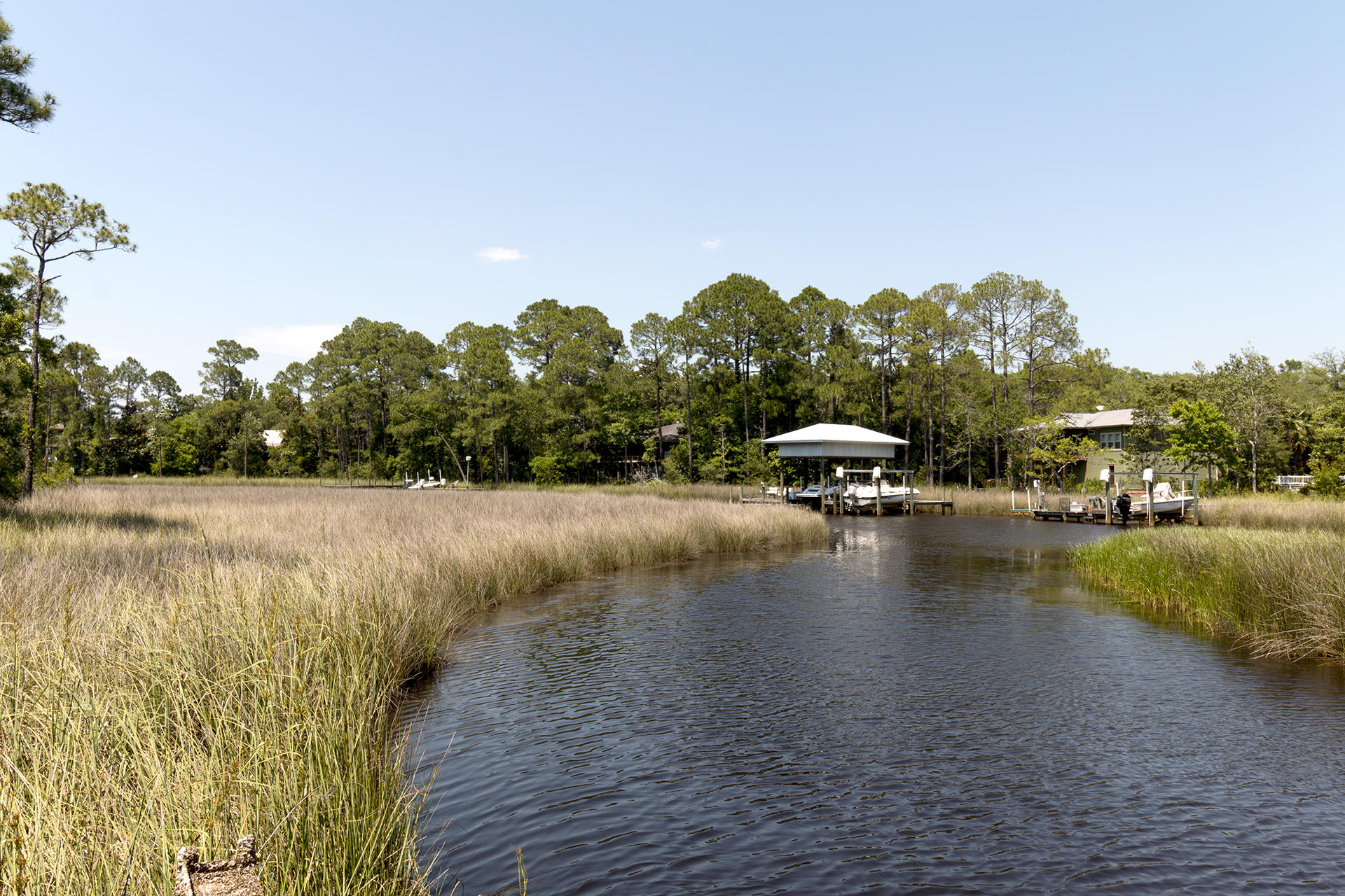 Gorgeous Bayou front lot with 121 Feet of waterfront. Enjoy peace & quiet in a natural Florida setting. This lot is over .80 of an acre and is just a short drive to shopping, restaurants, entertainment, & the beach. Located in a quiet area and just a short walk to Eden State Park. Build your perfect water front home.