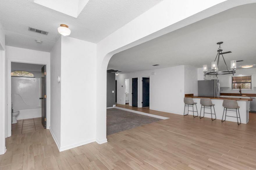 **Motivated seller offering to contribute $15,000 toward interest rate buy down, closing costs, with full asking price!** This brick home is nestled just outside the gates of Hurlburt Field, offers the perfect blend of space, privacy, and convenience. This property has a range of features that make it a standout choice in today's market. 3% interest rate assumable VA mortgage for qualified buyers! As you enter the home, an archway leads you from the foyer to the dinging room and living room. The layout features two distinct wings, ensuring comfort and privacy for all residents. On one side, the hallway from the front door leads to two guest bedrooms and a bathroom complete with a single vanity and a shower/tub combo. Across the main living area, the other wing offers two additional guest rooms, an extra guest bathroom, and comfortable owner's quarters featuring an ensuite bathroom for added convenience. The u-shaped kitchen features recently replaced stainless steel appliances and an abundance of cabinet space, making meal preparation and storage a breeze. The indoor laundry area is conveniently located just off the kitchen, adding to the home's functionality. A standout feature of this home is the provision of two water heaters on opposite sides, ensuring that hot water is readily available without any hassle, even when multiple family members return from a day at the beach. In the rear of the home, you'll appreciate the large screened in porch and privacy fence encircling the backyard, providing a peaceful oasis for outdoor activities, relaxation, and entertaining. 

Find peace of mind for years to come with the long list of upgrades and features including roof replaced in 2021, HVAC and smart thermostat replaced in 2022, New appliances in 2022, wood look tile and carpet installed and patio screens replaced in 2022, 1 water heater replaced in 2020, partial fence installed in 2020. Kitchen refrigerator, plus garage refrigerator and washer/dryer convey! 

For the astute investor, the high military turnover in the area makes this property an excellent rental opportunity. Its proximity to Hurlburt Field, Eglin Air Force Base, downtown Ft. Walton Beach, Destin and the pristine white-sand beaches of Navarre ensures a convenient and desirable location for potential tenants.
In this rapidly growing area, you'll find yourself just a short drive from essential amenities such as gas stations, grocery stores, ample dining options, and major retailers like Walmart, Kohl's, Lowe's, and more.

Don't miss out on this incredible opportunity to own a spacious, versatile, and conveniently located property. Contact us today to schedule your private tour and make this house your new home! Note: The last 10 pictures on this listing are virtually staged to help visualize the space best use. Buyers to perform all due diligence and verify all pertinent facts.