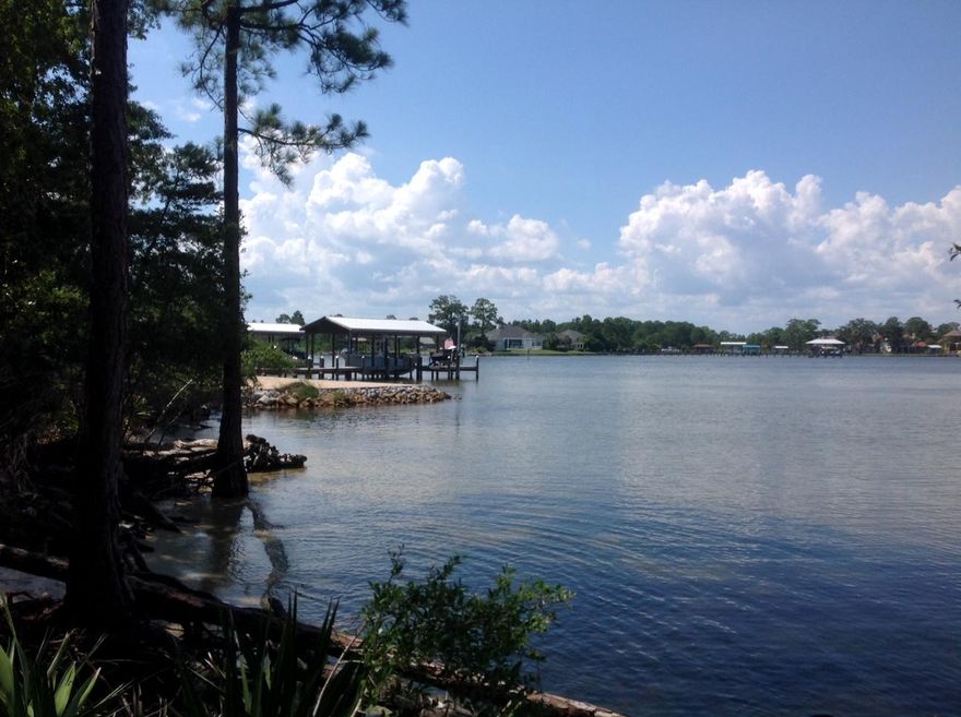 BAYFRONT LOT in Mack Bayou. HAVE A BRAND NEW SURVEY AS OF 7/3/2019 AND NOW WE KNOW WHERE SEAWALL CAN BE BUILT. This shows how much buildable land there is and where a Seawall and Dock can go. Also, have Aquatic Contractor pulling Permit. Beautiful neighboring homes. No HOA so build out according to your liking but, up to Walton County Building Codes. The VIEWS OF THE BAY ARE FABULOUS. Build your Dream Home and enjoy the open waters for Boating, Canoeing, Kayaking, Fishing and all the Bay has to offer. Buyer to Verify all Info. deemed Important.