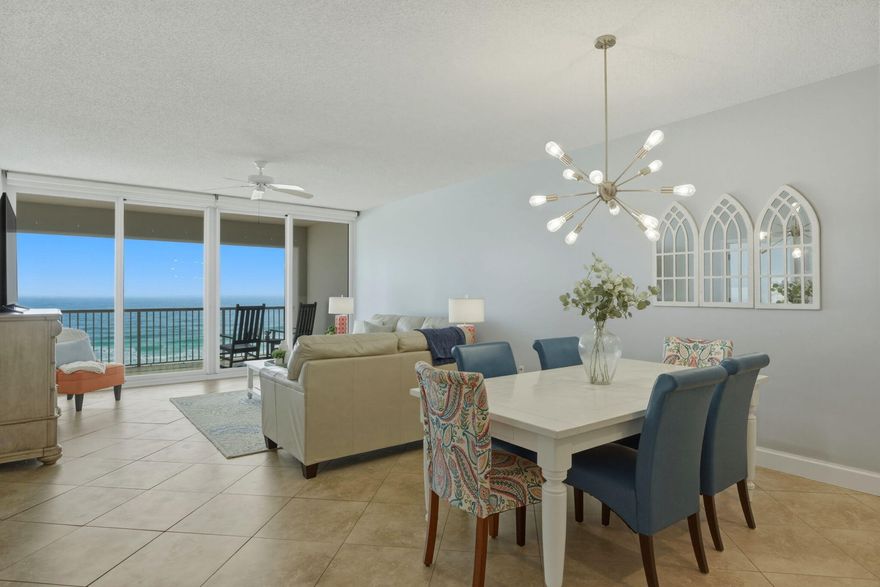 Welcome to coastal living at its finest, where emerald waters, sugar-white sand, and breathtaking Gulf views take center stage. This stunning beachfront condominium offers some of the best views on Navarre Beach, overlooking rolling waves, pristine shoreline, and the iconic Navarre Beach Pier--the longest fishing pier in Florida.Situated on the highly sought-after fifth floor, this residence captures the perfect vantage point: high enough for sweeping, unobstructed views, yet low enough to stay connected to the shoreline and natural beauty below. The views truly are just right. Inside, you'll find an open and airy floor plan featuring two spacious bedrooms and two full bathrooms, designed to maximize comfort and coastal views. The kitchen opens seamlessly to the living area with a generous bar top--perfect for entertaining while enjoying Gulf and pool views. Double sliding glass doors in both the primary suite and living room lead to an oversized balcony, creating effortless indoor-outdoor living.

This condo has been immaculately maintained and has never been used as a rental, though it is rental-friendly. Rental projections are estimated as high as $70,000 annually, offering excellent income potential for investors or second-home buyers.

The monthly HOA fee covers groundskeeping, elevator maintenance, pool upkeep, and portions of insurance, allowing for truly low-maintenance beachfront ownership. Enjoy private beach access via a beautiful wooden boardwalk complete with an outdoor shower and pergola, ideal for relaxing with family and friends after a day on the sand.

The home conveys fully furnished, with only a few exclusions--please inquire for the full list.

Conveniently located just over the Navarre Beach bridge, you're moments from local restaurants, boutiques, shopping, and endless coastal activities including dolphin watching, parasailing, fishing, and sunbathing.

This is a rare opportunity to own a pristine, turn-key condo with unbeatable views, income potential, and the laid-back luxury Navarre Beach is known for.