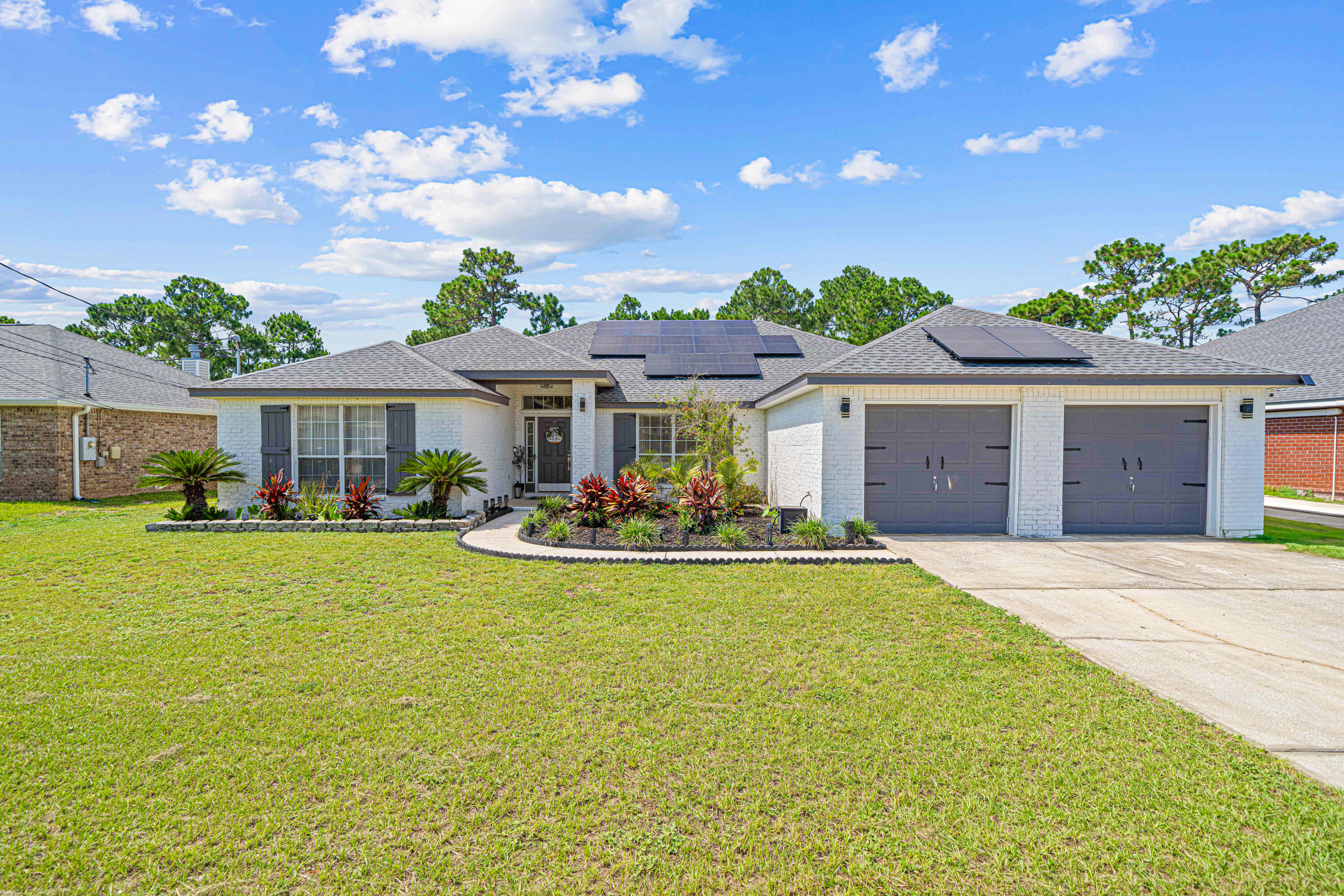This is the Navarre home you have been waiting for! Huge fenced-in backyard with brand new deck and newer roof (2021). This spacious home in Sky Ridge Estates is walking distance to Navarre High School, NYSA Sports Complex, convenient to military bases, and 3 miles from Navarre Beach and the longest fishing pier in the U.S.Step inside to an open layout featuring LVP flooring throughout and a large formal dining room just off the foyer--perfect for hosting dinner parties or holiday meals. The renovated kitchen has granite countertops, smart appliances (2024), a pantry, and a cozy breakfast nook--ideal for casual meals or morning coffee. The dedicated laundry room is conveniently located off the garage and includes tile flooring and mudroom space for added functionality. The split-bedroom floor plan offers privacy and flexibility, with three generously-sized guest bedrooms and a full bath located on one side of the home. The oversized master bedroom is a true retreat, featuring his-and-hers closets, and a spa-like en suite bathroom featuring a large garden tub, dual vanities, and a separate shower.
Enjoy Florida living in the fully-fenced backyard, perfect for entertaining, pets, or future outdoor additions. Barbecue with friends or relax on the brand new deck. Additional features include storage shed and oversized garage, ideal for storing vehicles, outdoor gear, or even creating a home gym.
This prime location is less than a mile from NYSA Sports Complex with year-round sports including football, baseball, soccer, and lacrosse. With quick access to shopping, restaurants, Hurlburt Field, and zoned for top-rated Santa Rosa County schools, this home is a must see. Schedule a showing today!