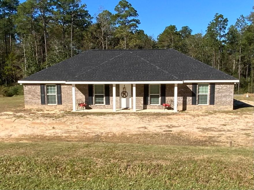 Beautiful contemporary brick home built in 2018. Situated on just over two cleared acres with a natural spring located in Ten Lake Estates with NO HOA! The living room, three bedrooms, and hallway have carpet and vinyl plank flooring are in the kitchen, utility, and two bathrooms. New lighting was installed in the kitchen, spare bath, and hallway. Recessed lighting installed on the front porch with motion sensor lights around the house. All three bedrooms are great size rooms with large walk-in closets and the kitchen features Whirlpool smudge resistant stainless steel appliances.