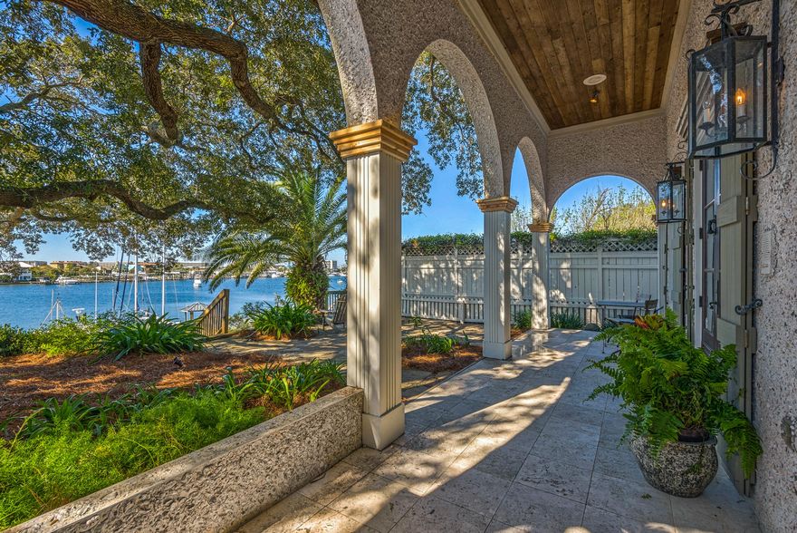 FOR THE BOATING ENTHUSIAST !!!! Harbor front living at it's finest in this elegant two-story home plus a carriage house. The 3,190 sql ft. main house has a total of 3 bedrooms and 4 baths and the 495 sq ft carriage house hosts one bedroom complete with kitchenette and full bath. This unique Harbor front home has been featured in home publications. The entrance is paved with a nougat-pale travertine slab; the wood floor a step below was milled from heart-pined beams salvaged from a Tennessee barn. The spacious living area is a loft like multipurpose space for cooking, living, and dining. The front door is an Italianate antique. The kitchen and areas for living and dining are gathered beneath a vaulted wood ceiling with exposed beams and sturdy fluted columns, the kitchen has Delicately leaded windows (stained glass) are from 19th century Alabama Church above. Enjoy the serene outdoor living space underneath the 200-year-old live oak (Grace).  Home comes with a large boat slip that will accommodate 75 to 80-foot boat plus a smaller slip with a 10,000 pound boat lift. The materials and finishes make up this exquisite home with its uniqueness down to the Coquina Shell covering the outside finish.  Located in the heart of Destin for you to enjoy all that Destin has to offer including fine restaurants, shopping and premier golfing. All dimensions and measurements to be verified by buyer.
