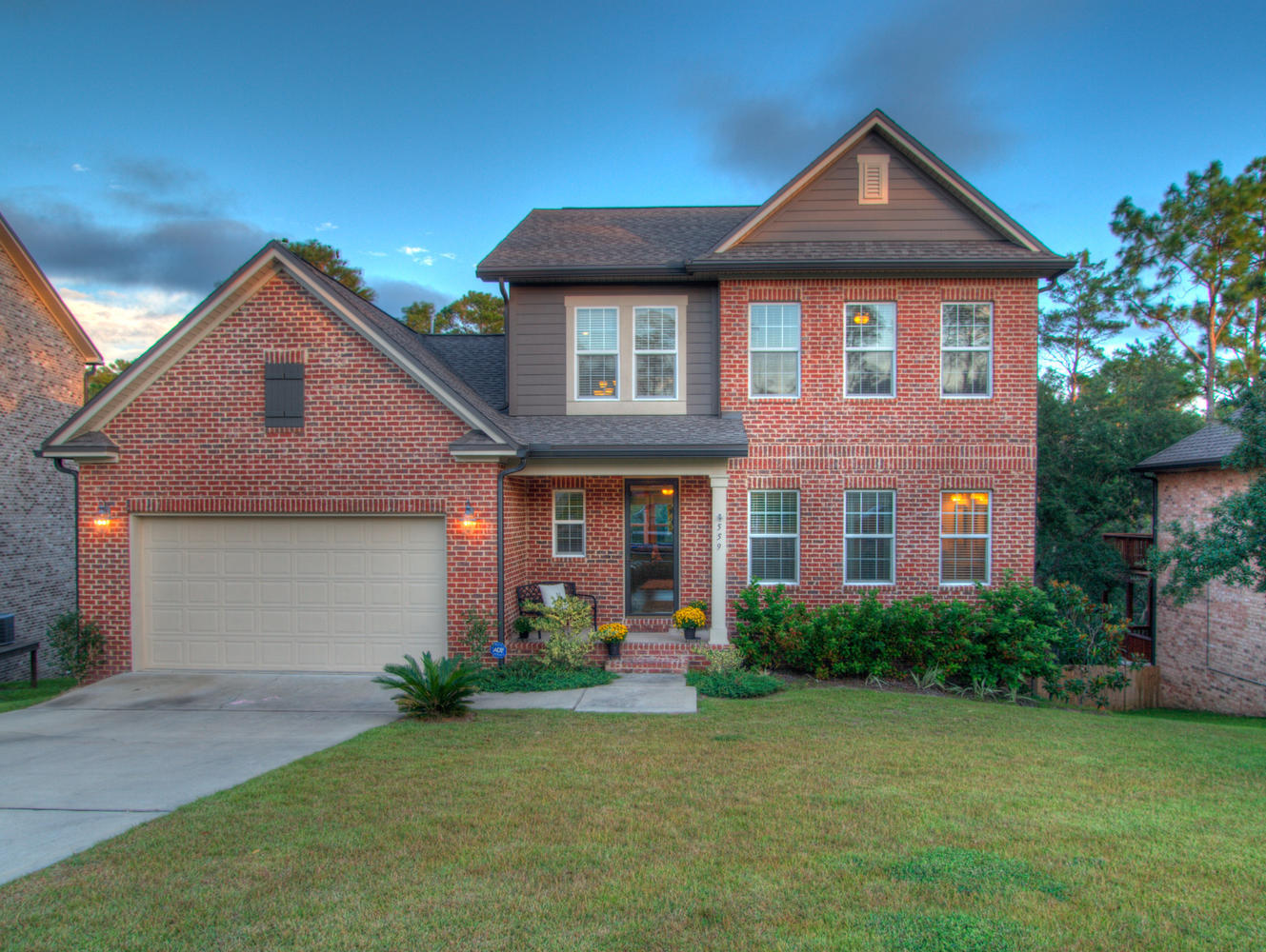 WALK-OUT BASEMENT, GUNITE POOL, NEWER HOME IN NICEVILLE. This is one of the finest homes in our area! Great location to the bases, Niceville schools, great community with access to a 1 mile nature path on Turkey Creek. The home features an open living room, dining room and beautiful kitchen with custom white cabinetry accented by hardwood floors, tall ceilings, crown molding, and plenty of natural light. The kitchen is equipped with stainless steel appliances (all convey), large walk-in pantry, tile back splash and large island for snacking, entertaining or working. The main living area overlooks the green space behind the home and through the french doors you can enjoy the view of the pool and green space on the expansive deck! Also on the main floor is a half bath and master bedroom. The master bedroom is spacious with a separate soaking tub and walk-in tiled shower. Upstairs are 3 over-sized bedrooms, great sized closets and full bath with dual sinks.
The walk-out basement is absolutely fantastic! It has a workout room, bar area for drinks and snacks, large family room, playhouse nook, and spacious fifth bedroom. There is easy access to the gorgeous gunite pool and spa from the basement or from the upper deck off the main living area. The pool is surrounded by a custom paver patio with ample room for lounging or for playing. There is a wet step for dipping your toes in the pool that has a space for an umbrella to stay out of the sun. Under the upper deck the Seller's have built a large deck by the pool providing additional shade, a great area for hanging a hammock.