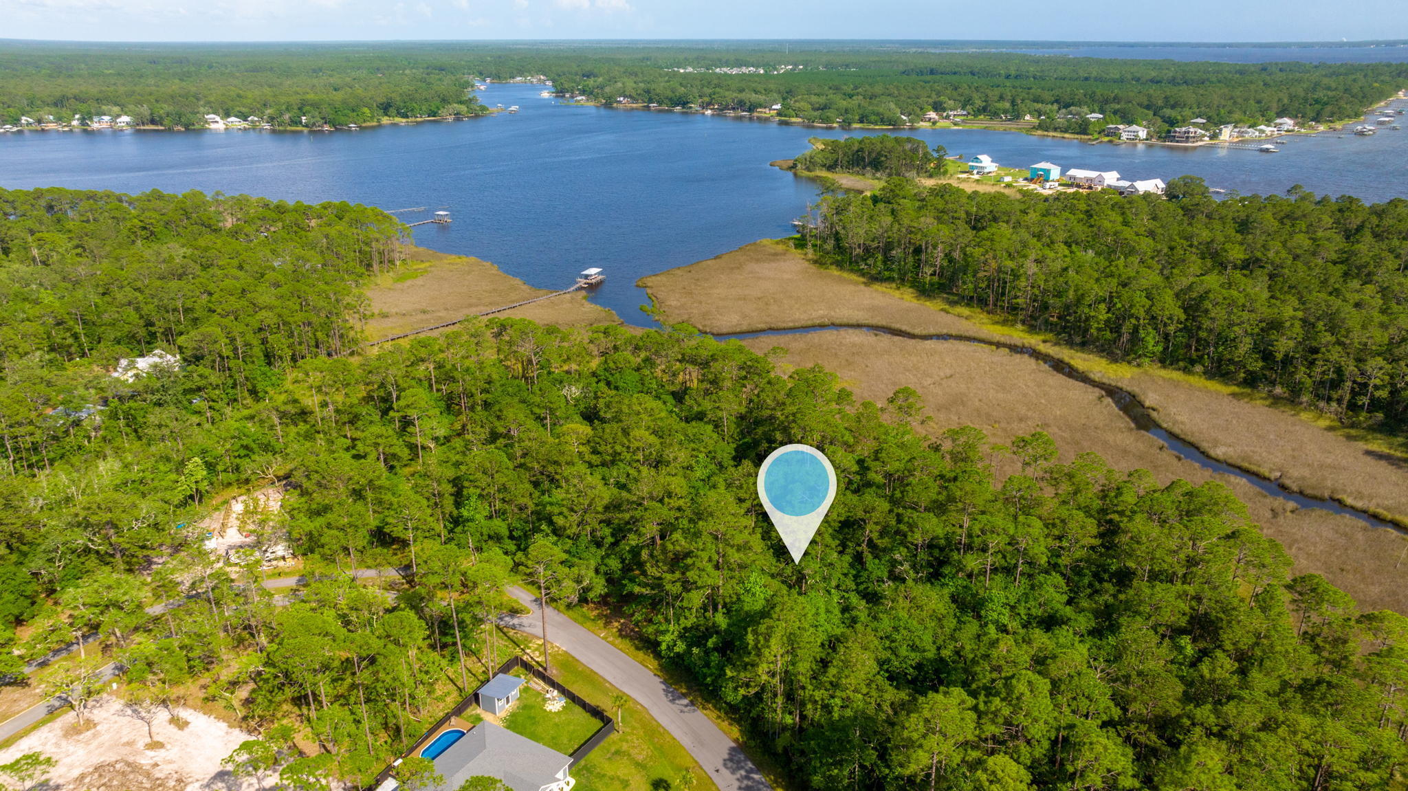 Looking for a great lot in the Freeport area with no HOA fees look no more - this is your lot at 0.57 of an acre, this is a larger lot with amazing views of the bay! The lot is wooded and centrally located right off of East Bay Loop. Lot provides amazing views and is great to build your dream home! Easy access to Blue Water Bay and Destin!