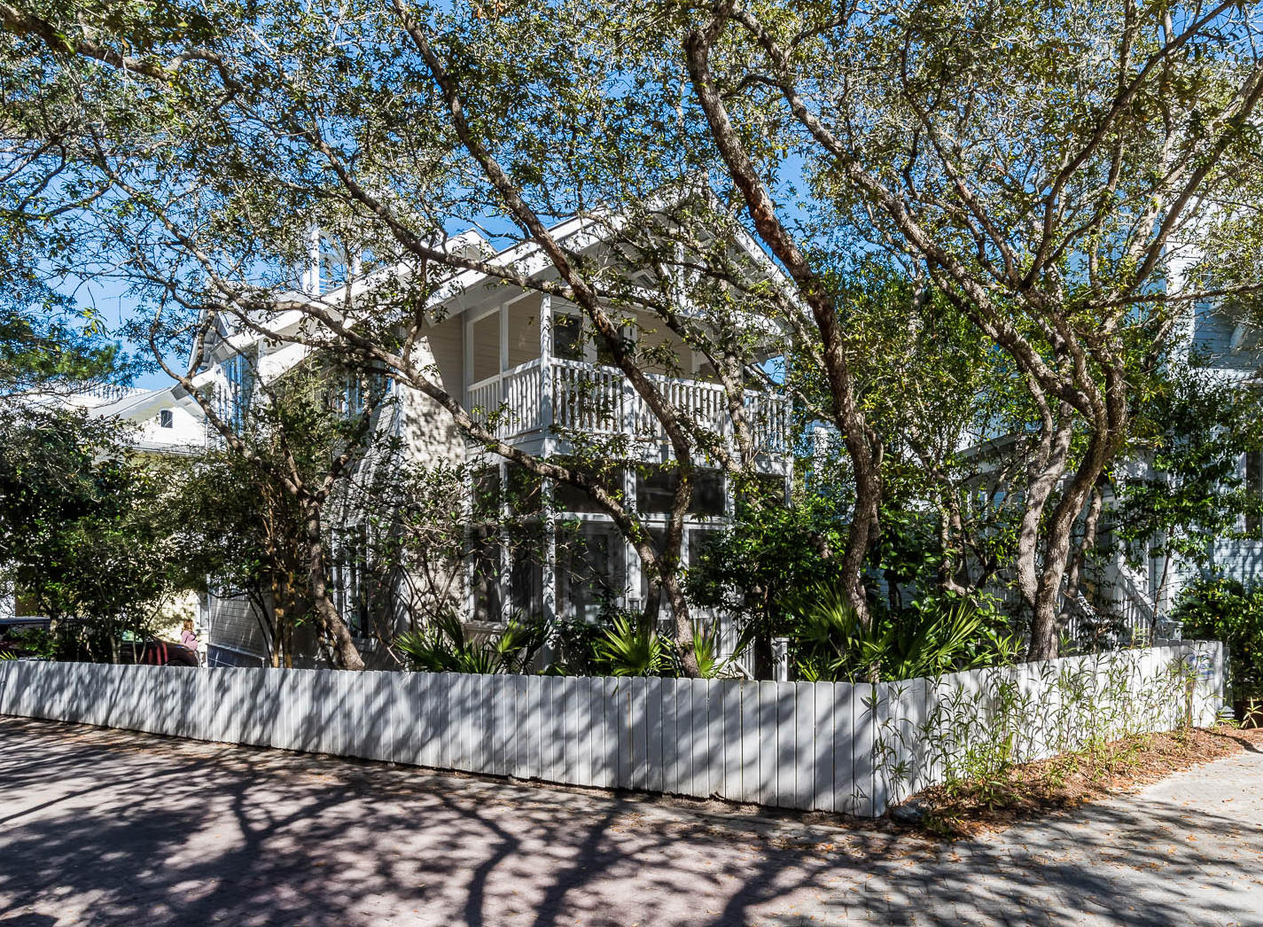 Wave Length sits on the highest point in Seaside shaded behind a garden of live oaks, magnolias and other native vegetation. The home was professionally redesigned and upgraded bottom to top. Wood used throughout on ceilings, walls and floors and painted a crisp white. Custom made linen window shades and drapes allow the light to filter inside. The front living area with custom designed day bed has 2 extra-large twins and serves as a sofa during the day. A wall of book shelves and a perimeter shelf will show off your collection of sea shells. A second living area includes a queen sleeper sofa. The breakfast bar is adjacent to the dining area with under counter ice machine & beverage refrigerator. The custom designed kitchen is a chef's dream: Carrera marble countertops, custom made
