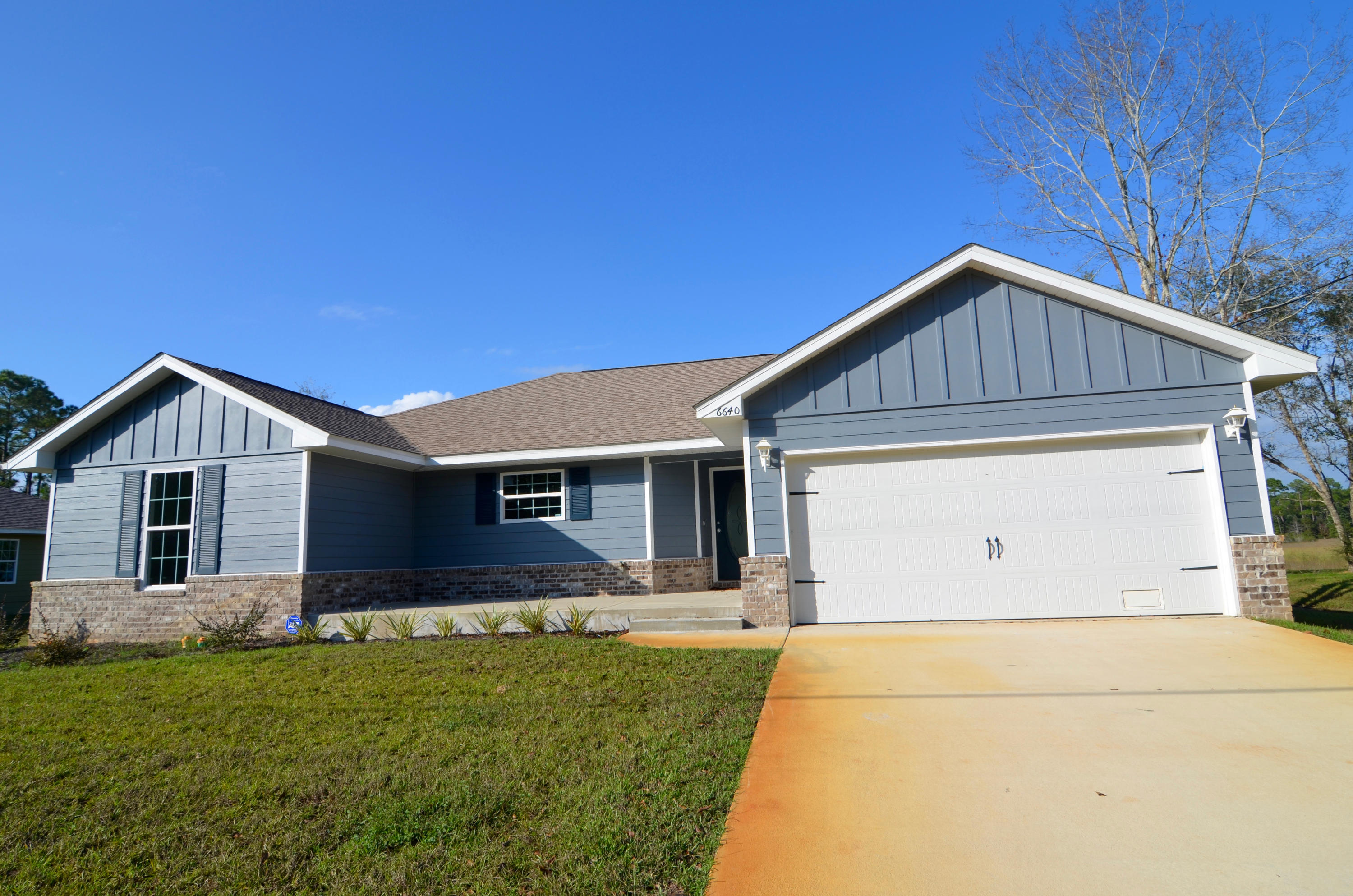 JUST REDUCED BY $24K!! BRAND NEW home with deeded access to the bay. This gorgeous 4 bdrm, 2 bath home is located on a .9 acre lot with access from the canal to the bay along with a community boardwalk and fishing pier directly on the bay. The home features alarm system, stainless steel appliances, granite counter tops, kitchen island, recessed lighting, ceiling fans throughout, fabric shield hurricane window protection, 16'' tile in entry, kitchen, dining area, all bathrooms and laundry. Wall to Wall carpet in Living, Dining and all Bedrooms. The backyard is fully sodded with irrigation system and features a 10'x 15' deck overlooking the bayou. Located close to shopping and beaches, this home is a must see. Buyer to verify all information to buyers satisfaction including but not limited to sq. footage, room sizes, lot size, zoning etc