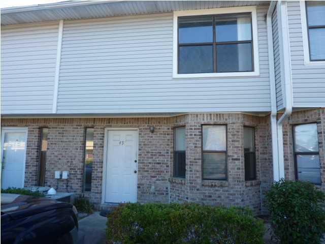 Two large bedrooms and two baths upstairs, eat in kitchen, inside laundry, small fenced back yard, boat dock, easy access to both bases.