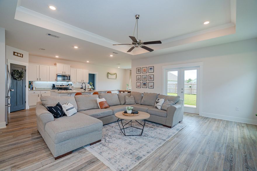 *Sellers will offer $5,000 in closing cost assistance with acceptable offer.* This like new turn key Smart home located in Forest Bay Estates in E. Gulf Breeze is a must see! The possibilities with this 4 bed, 3.5 bath Camden floor plan are endless! Not only does it have a 3-car garage but it also has a bonus space/mother in law suite set up.  The 2 front bedrooms are Jack & Jill, sharing the bathroom.  The living room has 10ft trey ceilings w/crown molding and a floor to ceiling built-in shiplap electric fireplace. The kitchen boasts a large island w/ storage, granite countertops, SS appliances, upgraded backsplash, cabinet hardware and sink faucet as well as custom shelving in the pantry. The large primary bedroom also features 10ft trey ceilings. The en suite has a large soaking tub, separate shower, shiplap accent wall, updated mirrors, light fixtures, updated cabinet hardware, granite countertops and custom shelving in the walk-in-closet. The 4th bedroom is off the bonus/flex space and features a walk in closet as well as a bathroom with granite countertops and a shower/tub combo.  The covered patio is perfect for entertaining or just relaxing.  Other upgrades include irrigation w/well, full privacy fence, gutters and updated landscaping.  It is also within walking distance to the gorgeous community POOL.  You do not want to miss this home!
