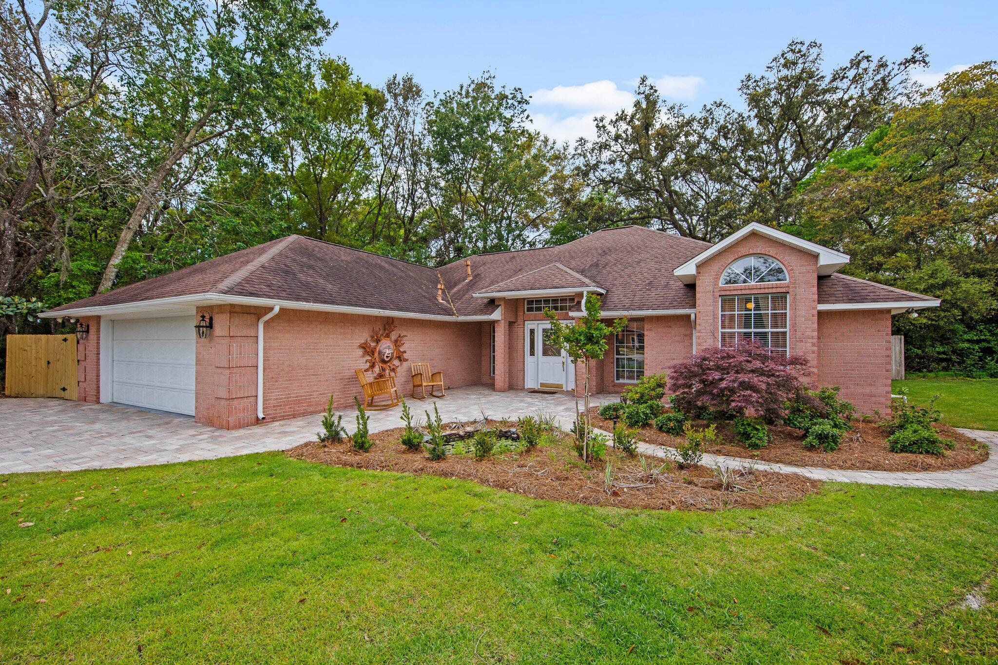 Welcome to this stunning 3-bedroom, 2-bath custom brick home in the vibrant golf cart-friendly community of Shalimar Point. This home is not just a place to live but a lifestyle choice that balances work, play, and relaxation.As you step inside, you'll be greeted by the soaring cathedral tongue-and-groove ceilings and a spacious living room with a gas fireplace and elegant custom built-insa'ideal for cozy nights in and entertaining friends. The adjacent sunroom provides a versatile, sun-drenched space ideal for a home office, playroom, or peaceful yoga studio.