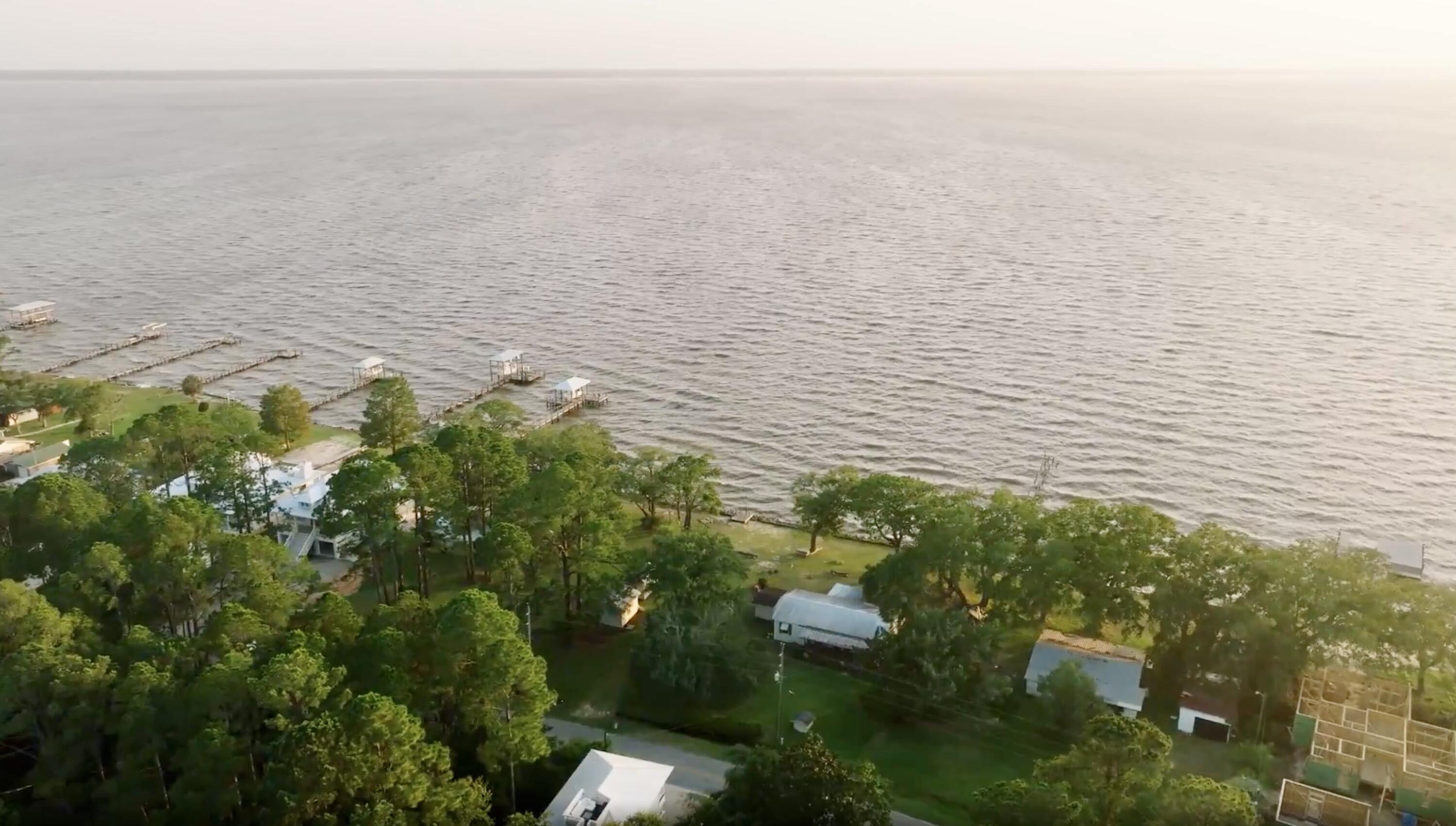 Discover the perfect waterfront lot on the Choctawhatchee Bay, offering breathtaking sunsets year-round. With a rip rap retaining wall already in place, this prime location provides serene privacy while delivering open views and direct access to both the bay and the Gulf. Ideal for building your dream home, this property blends peaceful seclusion with convenience. At the end of the street, Grady Brown Park provides many amenities including a kayak launch and two boat ramps with parking for boat trailers. Lastly, this location is just a short 10 to 15 minute drive to local shops, schools, restaurants, 30A and Grayton Beach. Make the bay your backyard oasis!