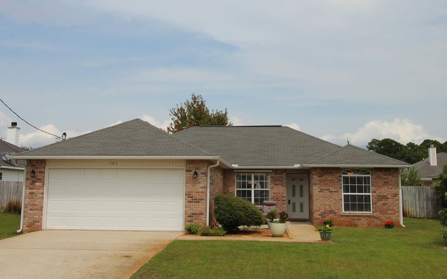 BEAUTIFUL HOME SITUATED ON A NICE WIDE LOT JUST WEST OF HURLBURT AFB IN THE DESIRABLE NEIGHBORHOOD OF WATERFORD ESTATES! Spacious living area with treyed ceiling, soft designer paint color, fireplace with tiled front and custom mantle and new leaded glass door that leads out to the large open patio and beautiful backyard. Dining area opens into the living area making entertaining a breeze. Light and bright kitchen with lots of counter space and cabinets, upgraded appliances, pantry and a breakfast bar. Inside laundry room. Master bedroom with a closet. Large master bath with double vanities, garden tub for soaking, separate shower, linen closet and a hidden door to the laundry room! Split bedroom floor plan allows you privacy from the children or guests. Each additional bedroom is