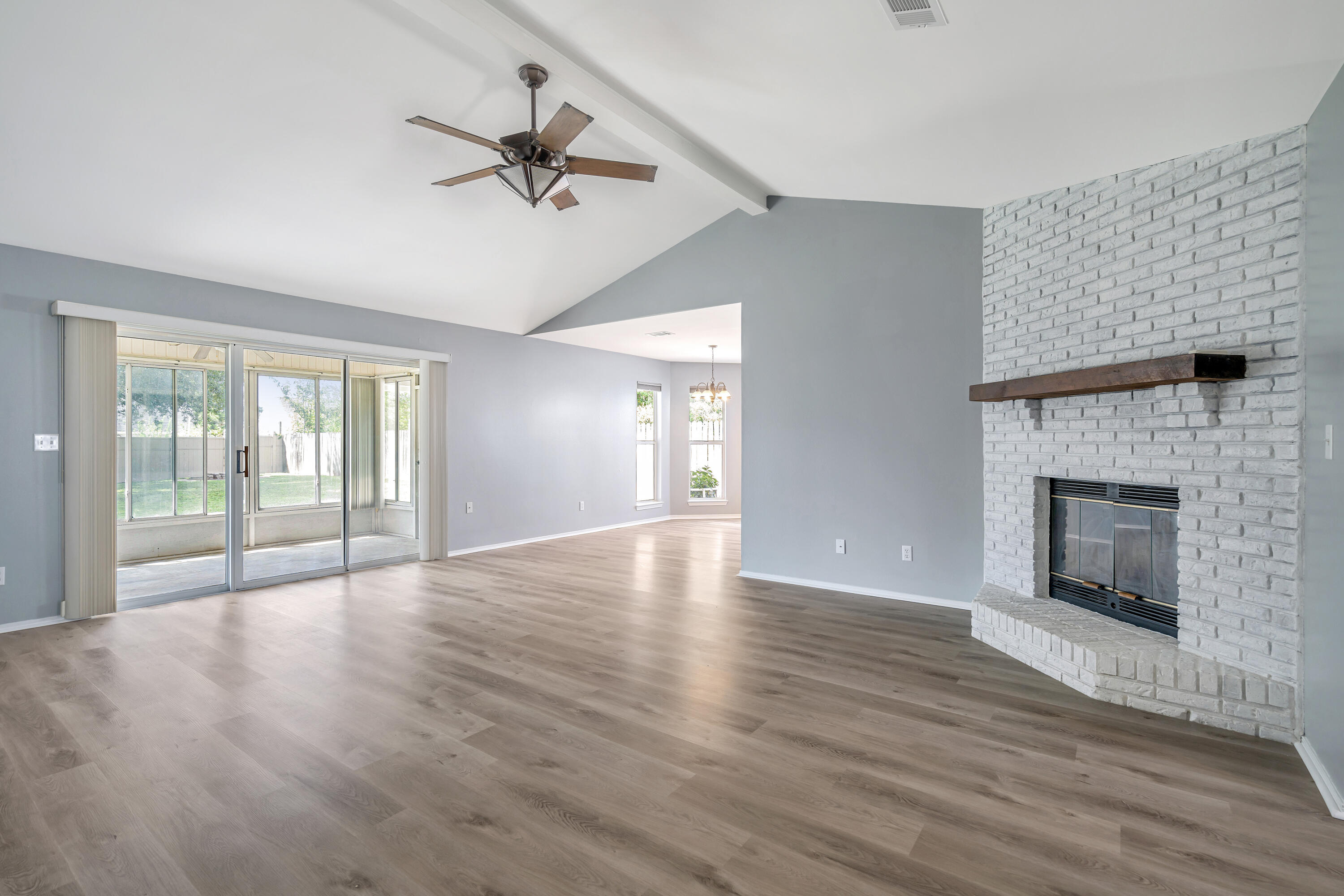 Fantastic price for a 4 Bedroom home South of I-10. Freshly painted and brand new Luxury vinyl plank throughout the home make this an easy move in. Bring your toothbrush! The fenced in backyard and mature trees make you feel at home right away. New Roof 2020, LVP Flooring 8/2023, freshly painted 8/2023, Hot water heater 11/2019, AC & handler 2021. Entering the home you are greeted with an open floor plan, vaulted ceilings & sweeping views of the backyard. Great home for entertaining! The 4th Bedroom is the only thing on the 2nd flman cave, oor which makes it a private retreat, theater room, den or teen bedroom. All 4 bedrooms have walk-in closets. The 2-car garage features built in workshop with attic above. The backyard is completely fenced in with mature trees & a screened porch