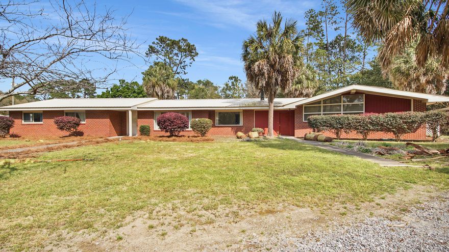 PRICED TO SELL.   Located on Back Lake a natural spring fed lake, perfect for water skiing, and all other water sports.  Excellent fishing.   Located in the city limits of Defuniak Springs.  Almost 2 acres.  Fenced back yard.  Attached workshop.  Move in ready, Seller firm on list price.