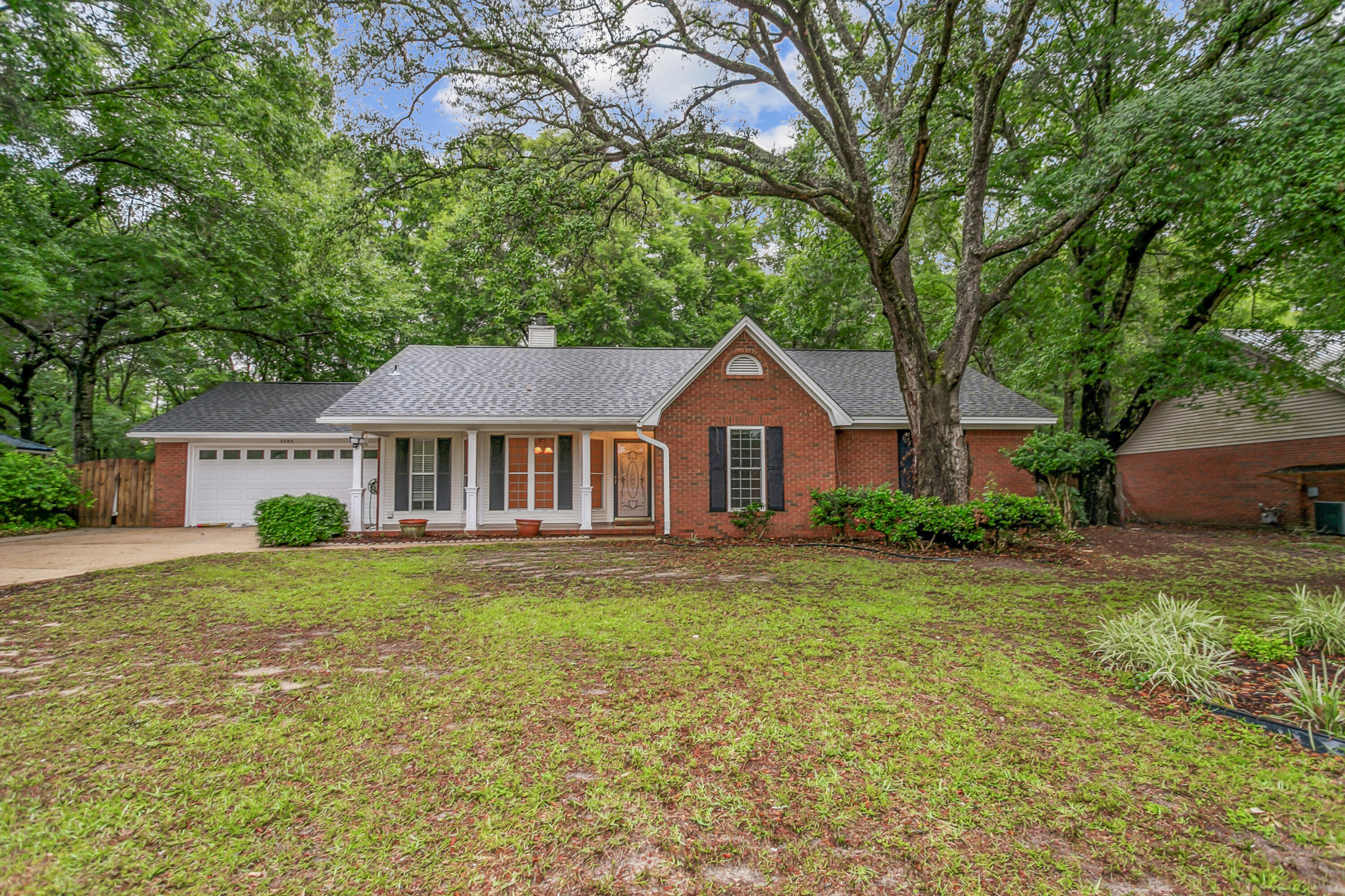 An Exceptional Brick Home in South Crestview: Discover this remarkable residence in the prestigious Savannah Oaks community. Known for its tranquil setting and elegant charm, this home boasts a striking brick exterior and a new roof. Enjoy relaxation in the glass-enclosed sunroom or screened Florida room. The garage features built-in cabinetry, while the rear yard hosts a spacious yard and a Workshop with AC and Electricity. Inside, find a well-appointed kitchen with maple cabinets and stainless steel appliances, complemented by vaulted ceilings. Cozy up by the stone fireplace or retreat to the master suite with a window enclosed area.
