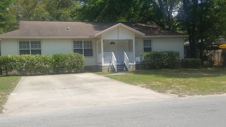WELCOME HOME!This lovely home welcomes you as you step into the cozy tiled living room. You will also enjoy the openness of the dining/living/kitchen areas. Each of these areas along with both baths have tiled floors. You're never at a loss for space in the kitchen - a plethora of cabinets and counters along with a kitchen island and breakfast bar!! Added comforts include ceiling fans and a built-in bookcase in the living room along with ceiling fans and large walk-in closets in each bedroom. The split bedroom plan brings an element of serenity in your master suite and you can also enjoy relaxing in your garden tub. Enjoy beautiful sunrise/sunset on your back deck. New AC in 2013. Lawn pump in back yard is not operational. Buyer to verify all measurements