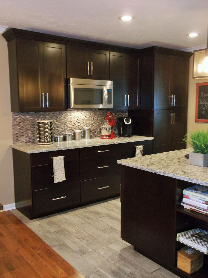 YOU WILL FALL IN LOVE WITH THE RECENTLY REMODELED OPEN KITCHEN WITH LARGE CENTER GRANITE TOP ISLAND & COUNTER TOPS, SOFT CLOSE CABINETS & STAINLESS STEEL APPLIANCES. NICE SIZED LIVING ROOM W/NEW PORCELAIN WOOD LOOK TILE in 2018. WINDOWS REPLACED IN 2017 ARE HURRICANE IMPACT RATED; WOOD LAMINATE FLOORS DONE 8-9 YRS AGO. MASTER BATHROOM W/GRANITE DOUBLE VANITY TOP AND NICE TILE SHOWER. NICE REAR DECK TO ENJOY YOUR GOOD SIZE BACKYARD. 3RD BEDROOM HAS NEW WOOD LOOK TILE FLOORS in 2018. GOOD SIZED LAUNDRY RM W/EXTRA CABINETS AND COUNTERTOP. ROOF IN 2005.