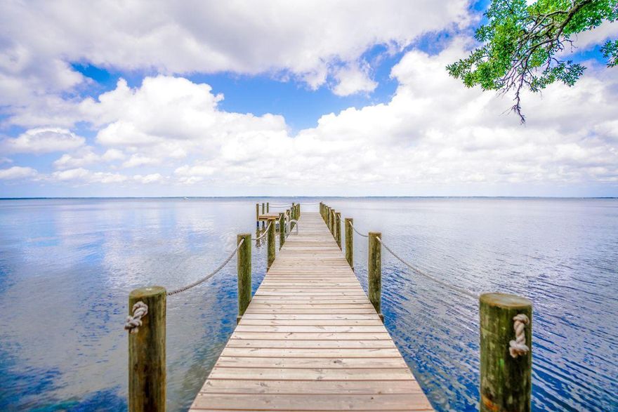 This new construction home was built in November 2019 and sits on 1.31 acres with incredible views of the Choctawhatchee Bay. Modern finishes include wood-tile flooring, stainless steel appliances, granite countertops, and beautiful bathrooms with walk-in showers. This spacious home offers an open floor plan, vaulted ceilings, a two-car garage, and a screened porch overlooking the bay. With no homeowner's association and over an acre of property, take advantage of the unlimited outdoor potential this tranquil home offers. Enjoy additional privacy from towering trees, as well as easy access to water sports and activities from your own private dock.