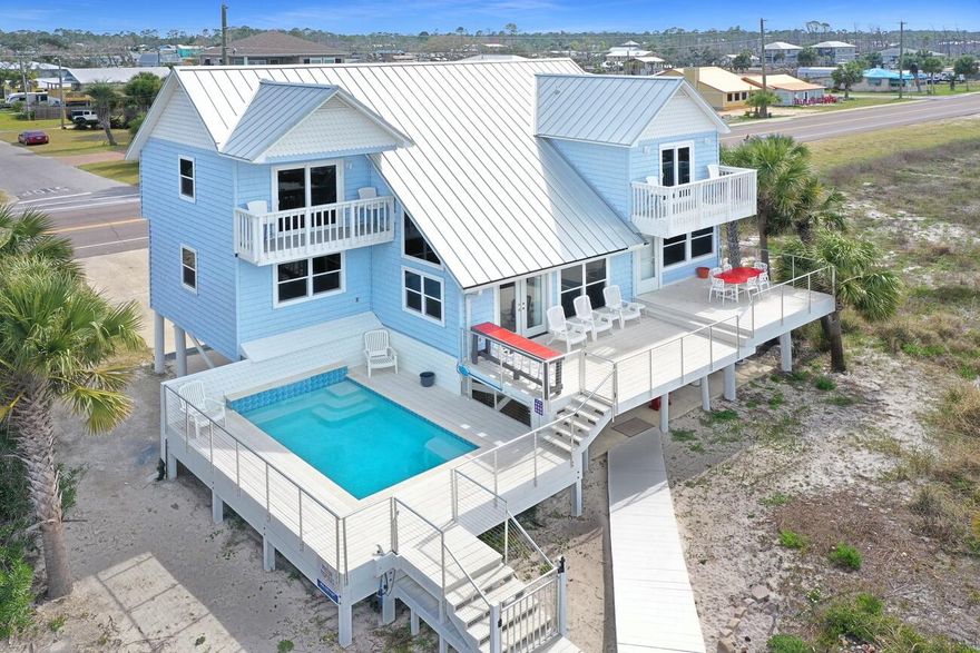Under contract ~ taking back ups!  Incredible opportunity to home a great beach front home located one of the premier locations in the area. This home has 300 feet on each side of it that can't be built on and provide unbelievable privacy and views. This home was renovated after Hurricane Michael which included the addition of fantastic elevated pool and large deck overlooking the beach. Great vacation rental grossing $190-$200k the past two years. Sold fully furnished and equipped. This is the quintessential 'Old Florida' beach house layout and setting mixed in with popular modern features and design. Tons of outdoor living areas, parking, and a rare opportunity to own a home located on one of these coveted locations. Rental guests will not be disturbed and home most be shown while vacant