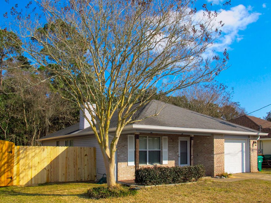 If you've been waiting for the right home where a little vision and effort can translate into real value, this is it. A blank slate ready for owner-occupants to move in and upgrade over time into your ideal home, or to flip. Brand new fence front and back! Systems are of insurable age and condition: Roof 2016, HVAC 2024; water heater 2015; electrical panel Square-D 1996. And, it's located only 4 miles west of Hurlburt Field, 10 miles east to Okaloosa Island, and 10 miles west to Navarre Beach, combining convenience with coastal access.This 3-bedroom 2-bath house greets you with a covered front porch, great for watching the neighbors walk or drive by. Stowe Road is a loop, eliminating through traffic and creating a quiet place to walk. Keep reading... ...As you enter the house, the vaulted living room ceiling provides a spacious airy feel, and the wood-burning fireplace evokes cozy evenings with family and friends. Through the opening, on the left is the dining area, graced by a large window for lots of natural light, and on the right is an open kitchen with a breakfast bar, pantry, and loads of storage and counter space. 

Down the hallway is a full bath, followed by the primary bedroom and bath, then two additional bedrooms. The primary bedroom lets onto a spacious open back deck, plenty of room for outdoor seating, grilling, and creating your own backyard retreat. The deck looks out towards green space...no neighbors over the back fence! There are plywood hurricane shutters in the shed (which conveys as-is) with space for your yard equipment. The lawn pump also conveys as-is. 

This is the kind of home where smart updates can create meaningful value. Move in, make improvements over time, and shape it into the home you've envisioned. Schedule a showing today!