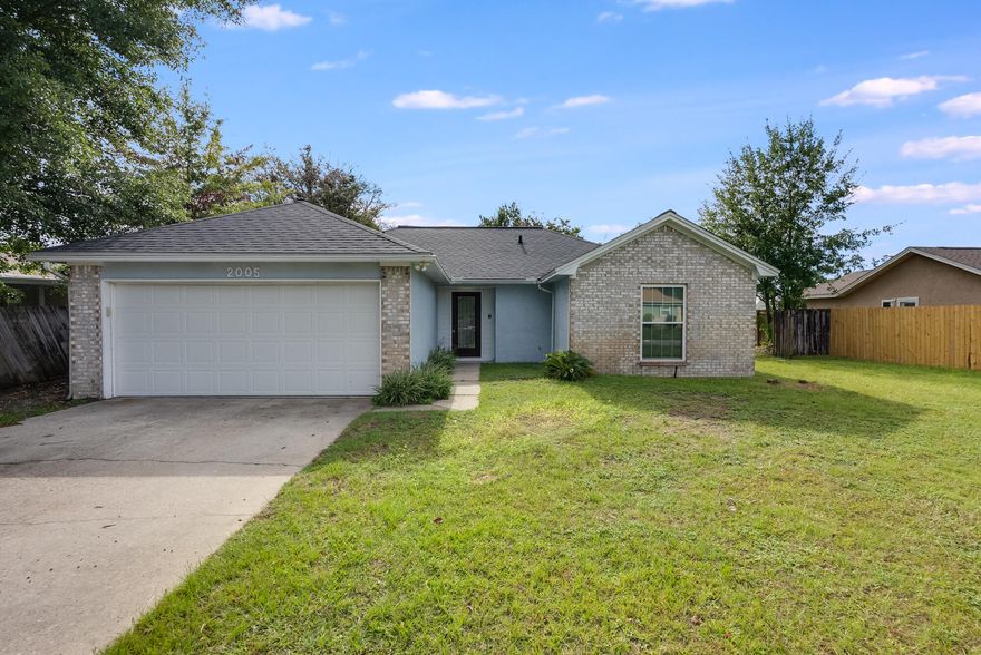 Step into the perfect family home located in the heart of Lynn Haven, central to restaurants, grocery stores, shopping and more! This charming home offers a 2-car garage, open floor plan and a fenced back yard. The interior of this home features expansive views of the backyard through glass sliding doors as soon as you walk in. Your eye is drawn up to the vaulted ceilings in the living room and is open to the dining room and galley kitchen. The kitchen features wood cabinetry and access to the laundry room and garage. The master suite also features vaulted ceilings and a sliding glass door for private access to the screened patio. Boasting a large walk-in closet off the bedroom and a spacious bathroom, this is sure to be the perfect tranquil retreat!