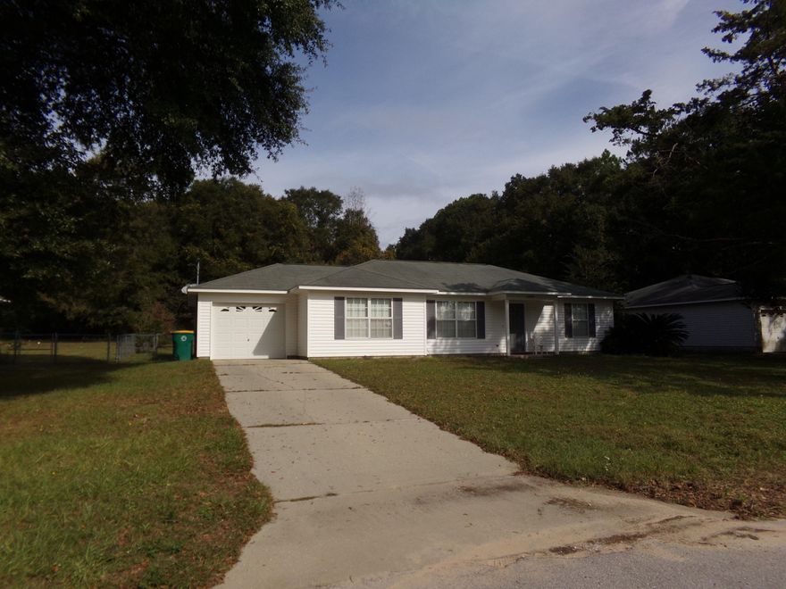 3 Bedroom, 2 bath, split floor plan~ Friese carpet in bedrooms and living room~ Tile kitchen, dining room and bath rooms~ The back yard extends approximately 60' past the chain link fence~ The kitchen has plenty of counter space and cabinets~ This home was built in 2006, but completely renovated in 2012, with new appliances, flooring and hardware and light fixtures~