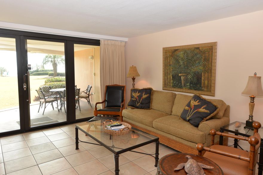 WOW!! OVER $38,000 IN 2015 GROSS RENTAL REVENUE!! This is one of the few one condos with this much square footage in the area. Walk right out of the condo on to a grassy area on your way to the pool or beach - no need to wait on the elevator!! This two bedroom, two bath condo has tile floors throughout, granite counter tops & pretty natural cabinets in the kitchen. It is decorated with a West Indies flair & quality furniture. These ground floor level condos rent very well with repeat guests booking year after year. Edgewater Beach abounds with amenities to include an awesome pool area offering two pools (one heated), waterfall spa & wading pool. There are four tennis courts, a fitness center, game room & children's playground. There is also beach volleyball, shuffleboard area &