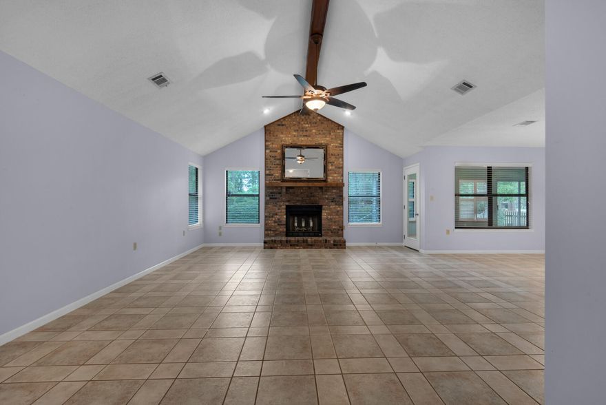 A fantastic cul-de-sac home in Bluewater Bay. The paver courtyard with wrought iron fence makes for picturesque setting. The split bedroom floor plan is highly desirable. The Custom Kitchen has every imaginable upgrade and the storage is incredible. From the maple cabinets to beautiful granite counters this kitchen does not disappoint. Mosaic backsplash, gorgeous pendant light over sink and breakfast nook area. Cabinets provide a spice rack, trash drawer, a glass display, corner lazy Susan and an appliance garage. The flooring is a tile that looks like wood. The family room with cathedral ceiling, brick fireplace with hearth and mantel. The master bedroom is very spacious with ceiling fan and walk-in closet. Seller is offering a $5,000.00 allowance at closing towards roof replacement. The master bedroom leads to the Florida room that is heated and cooled with plantation shutters. The Laundry room is off the Florida room with tile flooring, many cabinets for storage, sink, and folding counter space. Outside you will see the 12 x 12 Trex decking so no worries about replacement of worn out wood. The additional two bedrooms have ceilings fans and one with decorative wainscoting. The garage is oversized with work area or storage area for lawn equipment. The sprinkler system with new lawn pump makes keeping the grass green with minimal cost. The HVAC system was replaced in 2012 and the water heater was replaced in 2014. A termite bond in place and will transfer to homeowners.