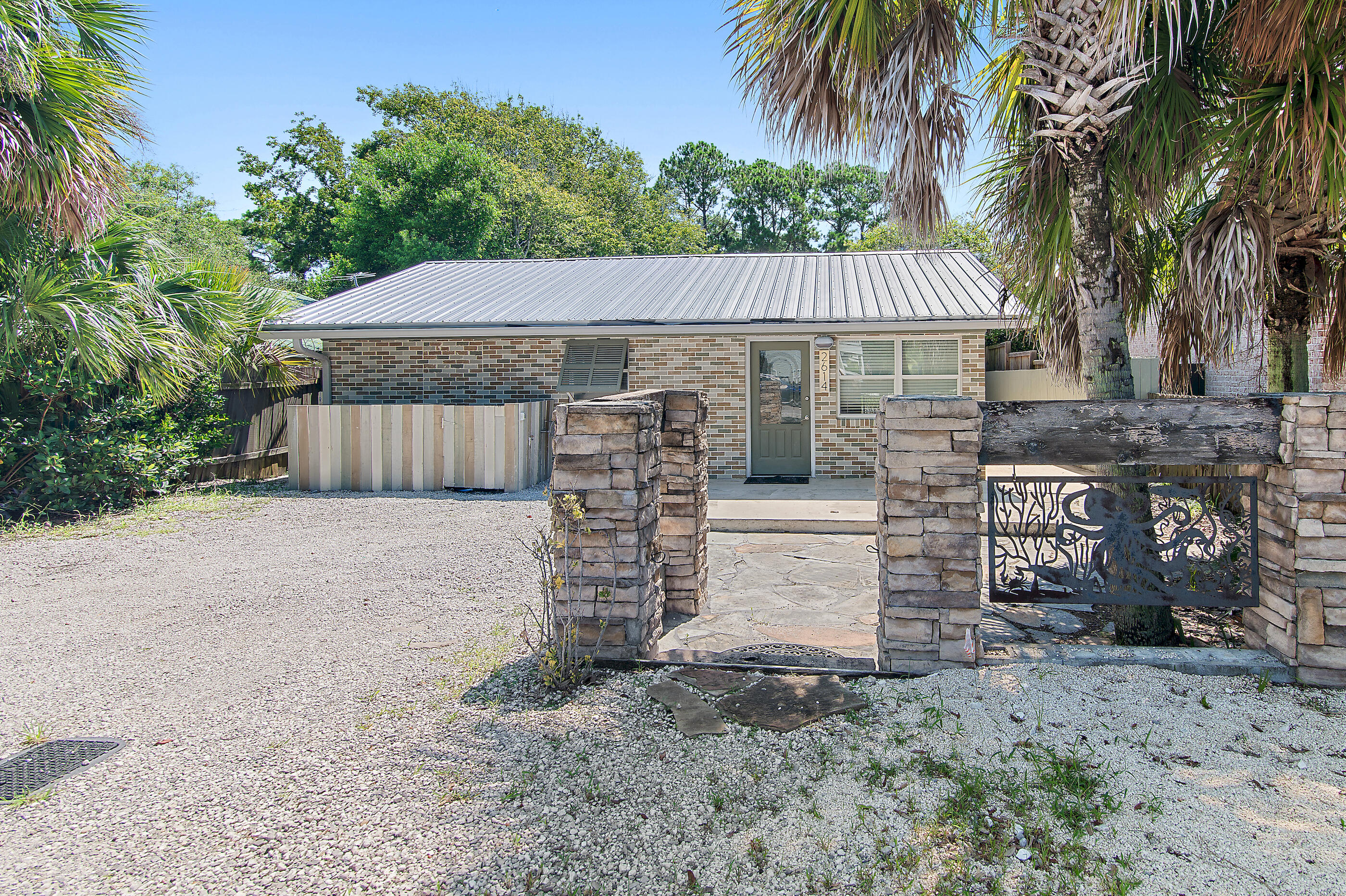 Quaint, classic Florida cottage, centrally located on W Hwy 30A in the historic community of Blue Gulf Resort. Short golf cart ride to Blue Mt Beach public park/beach access. Recently renovated inside and out. New metal roof, exterior paint. New cabinets, granite countertops, stainless appliances, are just some of the upgrades in 2021. New heat pump /handling unit 2023. Interior completely refurbished recently including brand new LVP flooring, built-in custom cabinets/shelving. 2 spacious bedrooms, plus a 3rd BR/ bunkroom. Crafted Baths, large walk-in closet off Main Bedroom. Bonus Flex room allows for additional dining/den or workspace that opens onto private rear patio/fenced rear and side yards for bike, paddle board, beach gear storage. NO HOA! Must see!