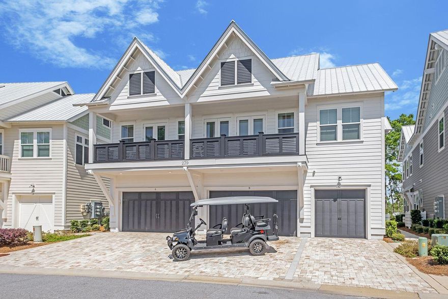 This fully-furnished townhouse in Prominence presents 'as new' and meets the highest standards of quality and design. Start on the first floor which greets you with a two-car garage housing a six-seat golf cart for exploring 30A hotspots. The attractive open living space makes a great first impression enhanced by light hardwood flooring, 10-ft. ceilings and fresh white decor. Natural daylight spills through the hurricane-rated windows and doors creating a light and open living space. There's a formal dining area for special meals and celebrations and a well-planned kitchen. You'll find ample storage space in a range of soft-close cabinets and the pantry. The center of the home will be the quartz-topped central island breakfast bar featuring an apron sink.
