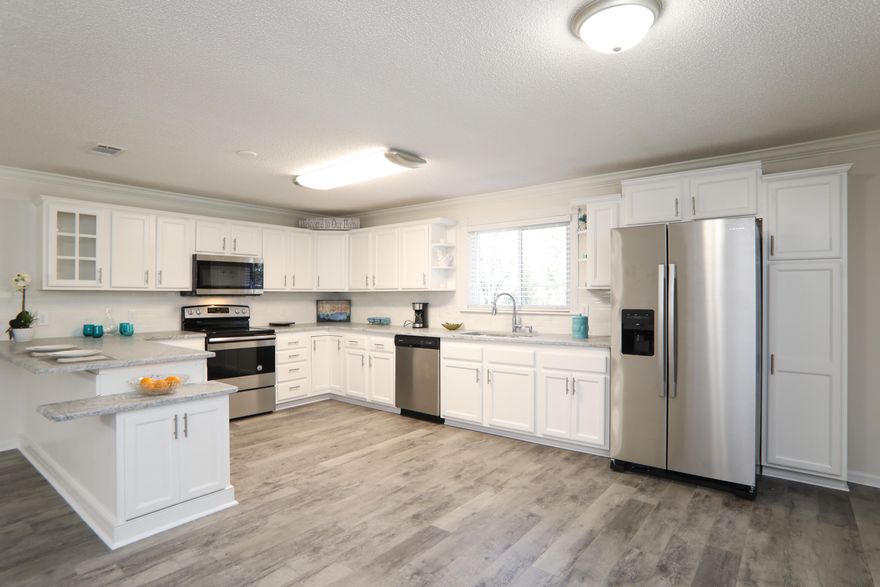 This home has been completely updated-3/2 1800 plus feet on 1/3 Acre near bluewater Bay- new interior and exterior paint,new ac,new roof,new floors,new update KITCHEN and baths with granite and quartz,new stainless steel appliance package- etc etc --