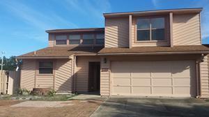 Spacious home in a superb location. Close to everything. Open Great Room with fire place will accommodate the entire family. Master bedroom is on the first floor and has a separate exit to the patio outside which also has a covered sitting area with storage. The additional bedrooms are upstairs with new paint and carpet. The tile downstairs is in great shape and the entire home has a fresh coat of paint. Home has been a rental in the past so it has great potential for this option in the future. Come see this one today you cannot beat the location!