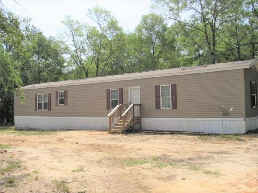 Unbelievably upgraded home includes tape & textured walls, 9 foot ceilings, upgraded kitchen cabinets, arch panel interior doors, and crown molding. Energy saving thermopane windows and upgraded insulation package means monthly energy $aving$! Beautiful kitchen with lots of cabinet space, work island with stainless steel sink, new dishwasher, smooth top stove, & recessed lighting. Transom windows above kitchen cabinets brighten the home with light! Stainless steel drop down hood vent with ceramic back splash. Huge open concept floor plan. Large MBR has glamour bath with soaker tub & shower - relax & enjoy! Home sits on 1.15 acre, has circular drive, county water. Wooden steps with landing at front & back door, flower bed. Paved road frontage, near town. Don't miss this one!