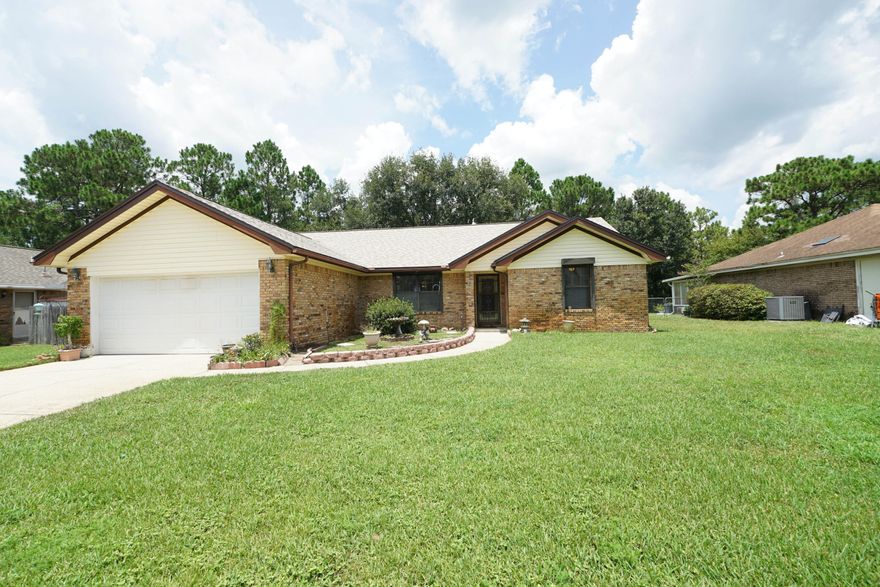 Charming Brick Home backing up to the Eglin Reservation- Minutes from Navarre Beach and Hurlburt Field!This home has been beautifully maintained. It is a 3 bedroom 2 bath mostly brick home nestled in a quiet neighborhood just off of Highway 98, directly across from the Santa Rosa Sound . The Roof, HVAC, and Hot Water Heater were all replaced in 2023. The Electrical panel was just recently replaced in July 2025. There are beautiful hardwood floors in most of the living areas and tile in the kitchen, creating a warm and inviting atmosphere.  Privacy  is key with this home having a split floor plan There is also a screened-in back porch that is ideal to keep free from Florida pests. If you want a great rental investment, or a great home in a quiet neighborhood , this home is for you!