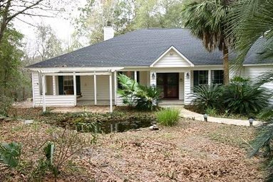 Looking for a secluded country home with city convenience? This one could be the one for you. Only minutes from town and convenient to shopping and schools. Some of the features in this home are a built-in security system, intercom and stereo system. There's a beautiful Koi pond with a cascading waterfall, surrounded by a ''zero scape'' area with plants that attract tons of butterflies. Some of the Koi will even stay for your enjoyment.You may also enjoy the split bedroom floor plan, cozying up to the fireplace in the large family room or enjoying evenings on the screened porch or deck. For you book lovers there's even a room just perfect for your own library. Read while looking out over the wooded back yard.WORKSHOP IS NOT INCLUDED IN RENTAL