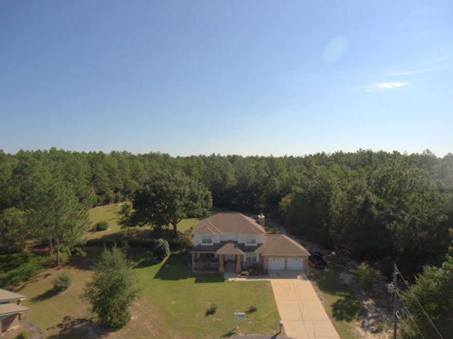 Check out this wonderful ''Farm Style'' home on 1.3 acres in town. All of the conveniences of town and privacy of country are here. Located at the end of a culdesac this home has 4 bedrooms and 3 full bathrooms, a large, custom built workshop, RV storage, high quality features and lower county property taxes! The interior, main level has 3 living areas (Living room, great room and sunroom),a guest bedroom and bathroom, 2 HVAC systems, a wood fireplace, high quality kitchen appliances, granite counter tops, nice flooring and many nice features throughout. The upstairs features 3 more large bedrooms, 2 bathrooms and a master suite. The master is very large and has a upper level balcony area overlooking your back yard and shop area. Outside you will find a wonderful piece of property.