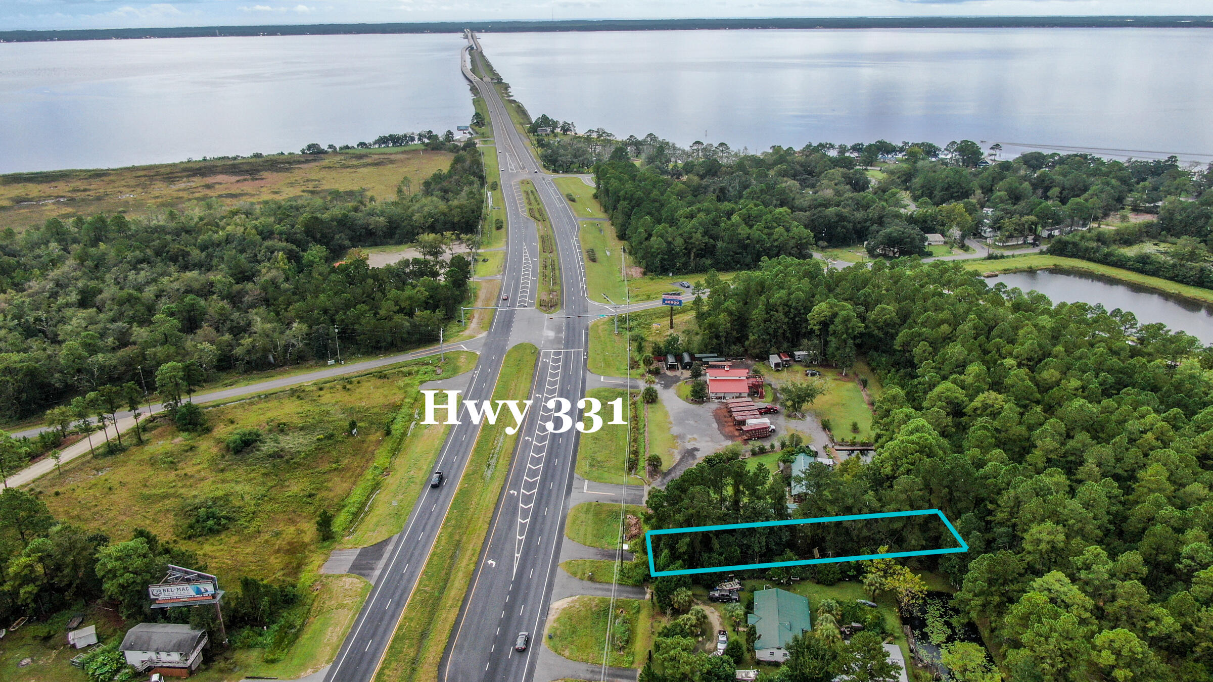 This vacant land is just over the 331 Bridge a mile in to Freeport on the south driving direction of Hwy 331. Many commercial business options such as plant nursery, retail, small restaurant, warehouse/storage, business/residential structure, and more. Zoned Rural Village and General Commercial. Seller will have land cleared. Has Development Order for heavy equiment business, landscaping, small building/business.