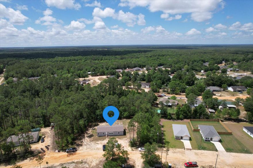 Now offering a $5000 seller concession for closing costs! This is an exceptional opportunity to own a stunningly affordable home on a large lot in East Crestview. This immaculate 2021 home features 3 bedrooms and 2 full bathrooms, offering a modern and comfortable living experience. No HOA and no flood insurance required! Located in a prime location on a large lot with convenient access to I-10, Highway 90, and 285, you'll have a quick and easy commute to Eglin Air Force Base and Duke Field, as well as an abundance of local attractions. You're also just a short drive from the world-famous beaches of the Emerald Coast! Step inside to discover a thoughtfully designed interior with an open floor plan that embraces both style and functionality. The spacious kitchen is adorned with a charming kitchen island, creating a central hub for family gatherings or entertaining guests. Large windows throughout the home allow an abundance of natural light to flood the living spaces, creating a warm and inviting atmosphere.