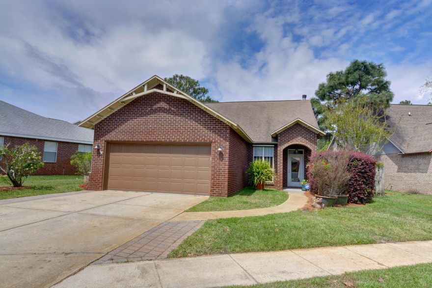 Serenity awaits! Welcome home to this breathtakingly updated lakefront retreat in the highly desirable neighborhood of Escada. This beautifully remodeled 4 bedroom, 2.5 bath boasts all the luxurious finishes you want, in the space you've been looking for, with the view you can't live without! Walk in the front door and enjoy a spacious open layout, with plank wood look porcelain tile throughout the entire bottom level. The chef's in your family will delight in this tastefully updated kitchen featuring granite countertops, stainless appliances and range hood, modern backsplash, pendant lighting, and new custom cabinetry (also extending into the laundry room!). Pride of ownership shines through every inch of this home and no detail was overlooked! The spacious master located on the bottom level is truly a refuge complete with a separate sitting room overlooking the gorgeous backyard. The master bath en suite has been completely reconfigured and features a custom made double vanity, soaking tub, and walk in tiled shower. Although you can watch tv in the custom cabinet built around the fireplace, you likely won't be able to take your eyes off the backyard. An oversized three panel sliding glass door was installed for entry into the screened in back porch, so you don't even have to walk outside to take in the view. However, enjoy a relaxing on your patio, or get closer and walk outside to your own sanctuary. The new landscaping creates a secluded backyard retreat with privacy hedges on the sides, and a peaceful view of the community lake (complete with a fountain water feature). Downstairs you'll find the half bath, and upstairs are three more nice sized bedrooms and an additional full bath. The flooring upstairs has been completely updated as well so that there is no carpet in the entire house. New paint throughout, popcorn ceilings removed, canned recessed lighting installed, active termite bond for preventative treatment, the list goes on and on! Do not miss this beauty, it is truly one of a kind! 