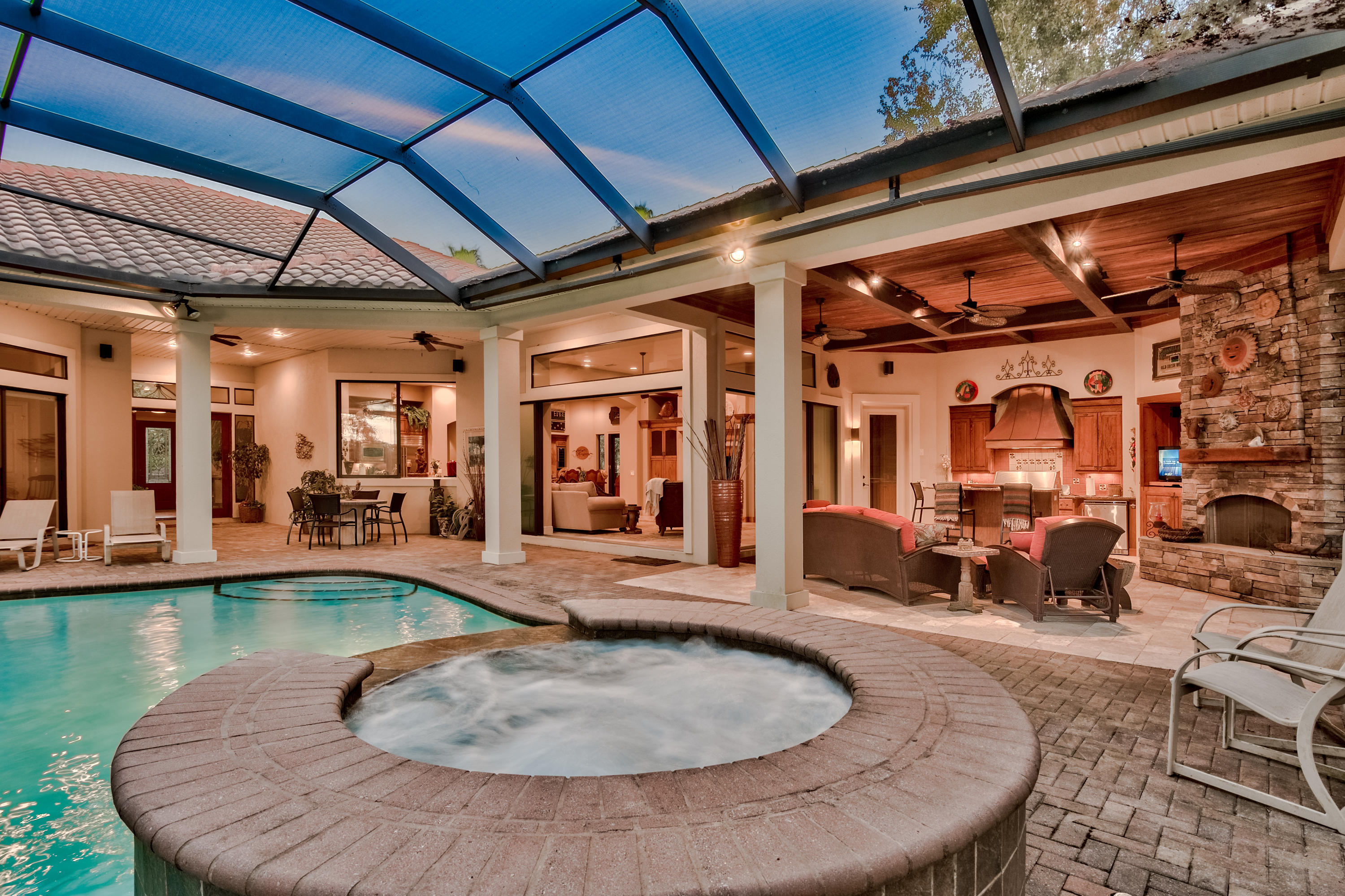 This timeless custom built home by Maurice Sweet showcases the truly signature design of 'bringing the outdoors in'. Situated on the 2nd-hole of Kelly Plantation Golf Course. Amazing indoor and outdoor living space, designed for entertaining. 3 Bedrooms/3 Baths/Office...