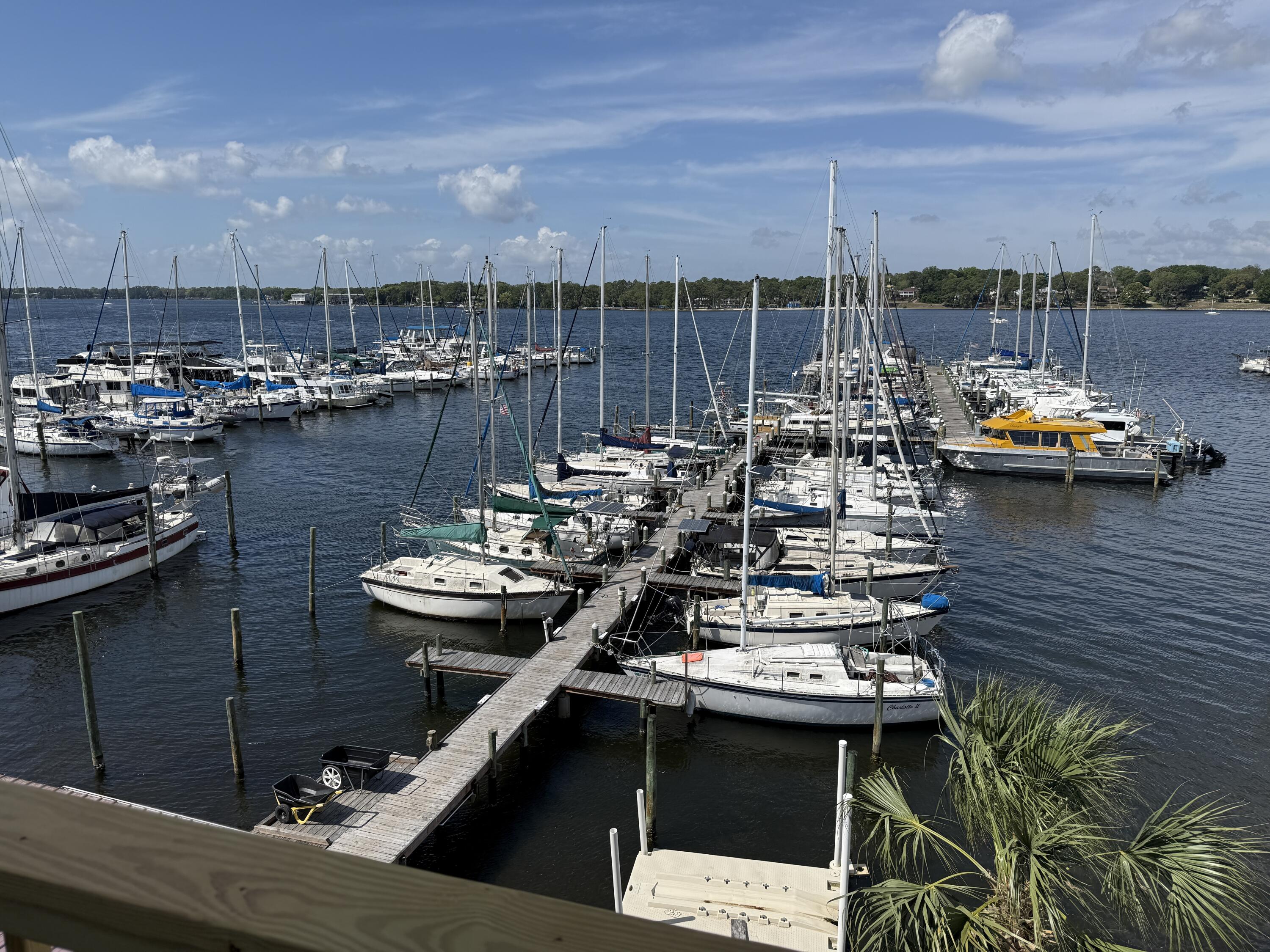 Discover this beautifully appointed 1,500 sq ft waterfront office suite at the Niceville Yacht Club, offering elevated water views over Boggy Bayou toward Choctawhatchee Bay and private balcony access from select offices. Nestled in the heart of Niceville's business district, This space features a versatile mix of private offices, open workstations, a break room, kitchen, and Full Bathroom, this space is perfect a wide range of professionals. Enjoy ample onsite parking and the convenience of being just 9 miles from Hurlburt Field, 4 miles from Eglin AFB, and 6 miles from Destin-Fort Walton Beach Airport (VPS), CAM includes water and sewer utilities, exterior building maintenance, and building insurance.
