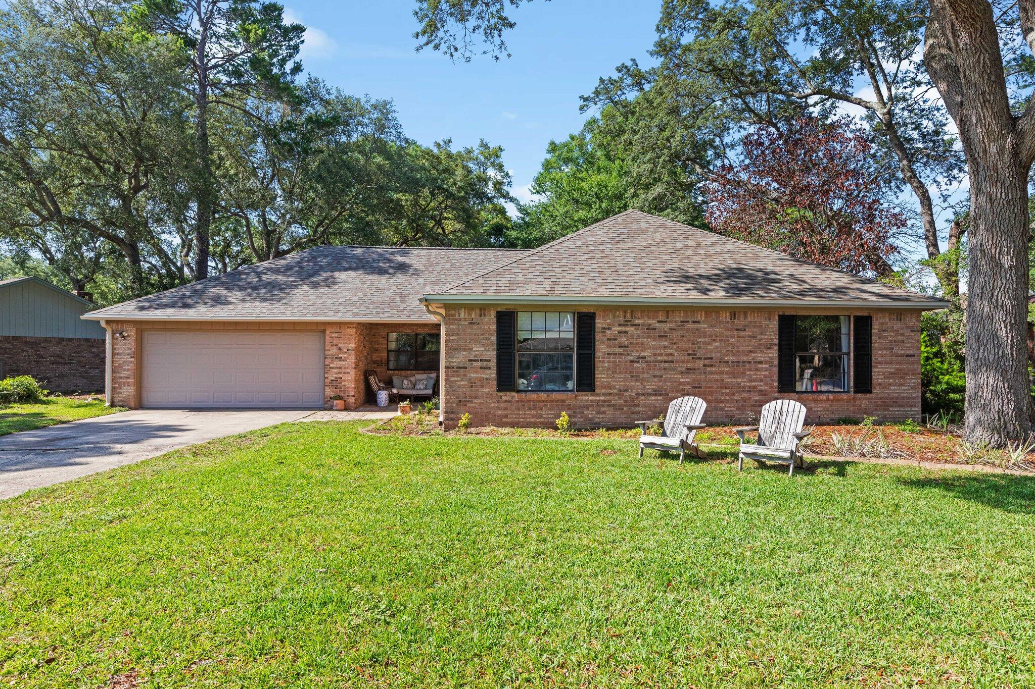 Experience the charm of this freshly roofed home in Niceville, free from HOA restrictions. The property boasts a spacious master suite equipped with a full bath and walk-in closet, complemented by three additional bedrooms. Both full bathrooms have been meticulously renovated to modern standards.The inviting family room, complete with a cathedral ceiling and wood-burning fireplace, is ideal for entertaining guests. The well-appointed kitchen seamlessly connects to both the formal dining and living rooms, offering a cohesive and open living space.Step outside to a generously sized, fenced backyard that provides exceptional privacy and space for outdoor activities.Conveniently located just minutes from shopping centers and a short drive from the beautiful Gulf beaches. This home is also situated within the sought-after Niceville school district.
