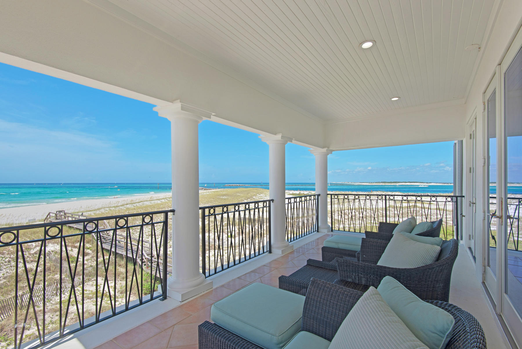 This elegant 3-story Gulf-front Home, by far, has the most spectacular views of the Gulf and Destin's East Pass in all of Destin. Each level opens to spacious balconies overlooking the Gulf and Destin's East Pass. If you are looking for a home directly on the beautiful white beaches of Destin, this home is for you. The home has 5 bedrooms, 5 baths, beautiful architectural features, fine finishes and is beautifully appointed. Located in the gated neighborhood of Destin Pointe, the home is perfect for a personal residence, second home, or vacation-rental . On the 2nd and 3rd floors, the home is equipped with motorized interior shades . Destin Pointe is a gulf-front gated community on Holiday Isle and amenities include gated security, lush landscaping, two swimming pools, and tennis courts ,