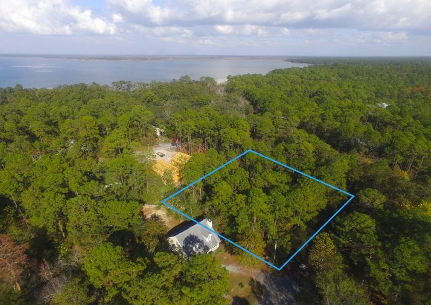 Great lot near the bay in Point Washington. Walk to the bay for fishing, paddle baording, or put in your boat for a fun day on the water!Point Washington is where the 30A locals live and love & Magnolia Beach is a great location for your family.Magnolia Beach features newly paved roads, some newer homes being built, a community boat launch and is only minutes to Grayton Beach or Seaside.Buy this lot to own a 1/3 acre lot near the bay for a larger home with yard or buy and hold.