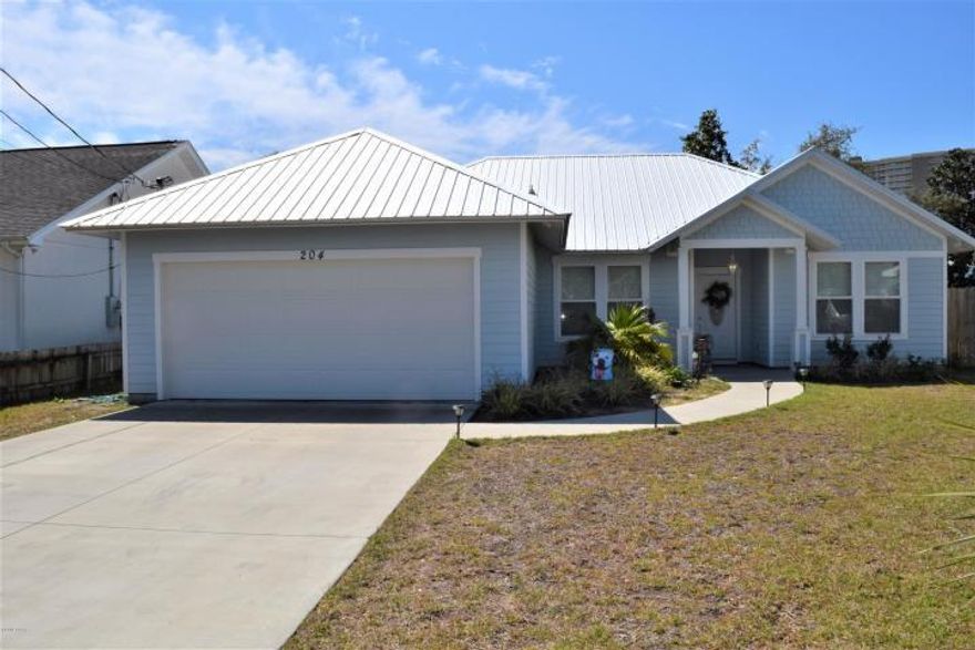 Practically NEW 2017 Craftman Style Home only 2 blocks from the Gulf. A short 5 minute walk and your toes will find the sugar white sand and our famous Emerald Coast green water. This home offers a spacious open floor plan that is perfect for entertaining or family gatherings. Beautiful wood plank tile floors, high ceilings, granite countertops, stainless steel appliances and the most elegant lighting and tray ceilings. Double vanity in the master bath as well as a large walk in closet and custom tiled shower with a rain fall shower head. The fenced in back yards offers plenty of room for a dog, children to play or even space to put in a dipping pool. The 2-10 Builders Home Warranty is transferrable to the next owner. This one will not last long.