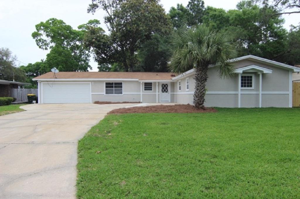 Newly remodeled 4 bedroom 3 full bath with a 2 car garage in Elliots Point subdivision. The living room was updated with travertine floors, recessed lighting, knockdown ceilings. The kitchen has been remodeled with new painted cabinets, new granite installed, stainless appliances with a built in oven and warming tray. Recessed lighting and a breakfast bar. The main master bedroom has new carpet, tiled wood burning fireplace, and recessed lighting. The all new master bathroom has a large walk in shower, double vanity, and new lighting. The second master bath was remodeled with new tile flooring, new vanity, mirrors and lighting and the shower was refinished. New copper wiring 2008, new roof 2007, stucco 2009, AC and Heat 2006. Brand new screen porch 2017! New irrigation pump 2017. New