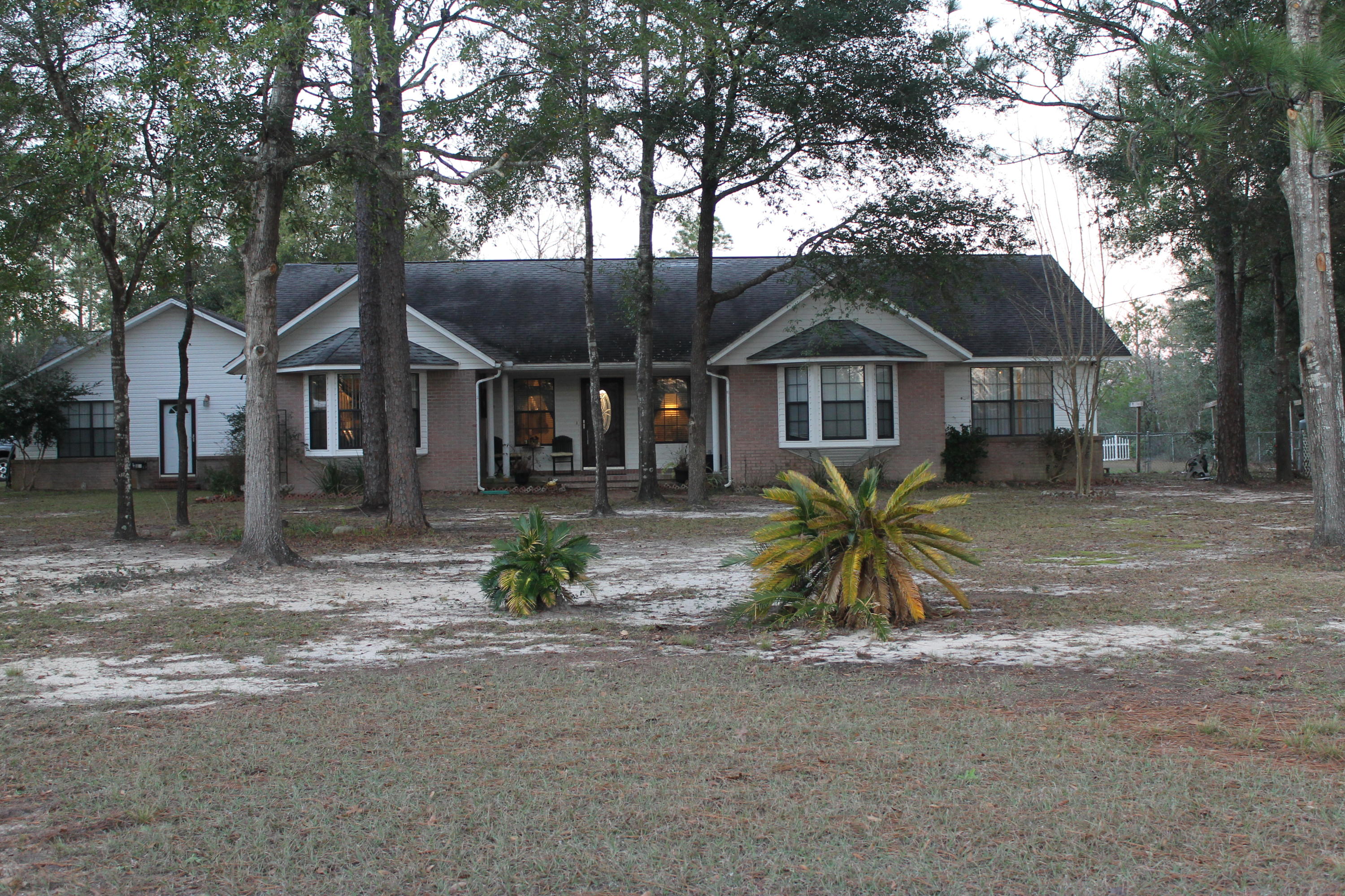1.83 ACRES,SUPER CLOSE TO TOWN!! MAN CAVE? THERE'S BETTER! 2 car detached garage/workshop with electricity! Living & relaxing's easy! Room for all on this sought after acreage!from the open kitchen/eating areas (formal & nook) to a liberally sized great room with fireplace to an expanded Florida room, you'll enjoy life more in this home with lifestyle options for all.Summer is around the corner! Jump in to your sparkling pool complete with enclosure to keep you comfortable night and day. In-law quarters with private entry or bonus room, to separate attached office/small business/salon off the oversized garage, you have choices for multiple-uses that suit your family as they grow.