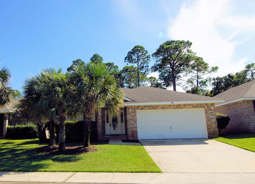 Deeded water access and private beach community! This open, split bedroom floor plan (see rendering under ''Documents'') has 2 living areas for space for everyone . The master suite includes a separate walk in shower, tub, double vanity and over sized walk in closet. The kitchen offers a new microwave, convection oven and hop up bar for casual dining. Other sought after features include 4 bedrooms, all brick exterior for easy maintenance, wood look laminate throughout, plant ledges to display your objects d' arts and underground utilities. Property backs up to a protected conservation area. White vinyl fencing encloses the back yard for pet security and safety. Don't miss the boardwalk down to Santa Rosa Sound where you can enjoy fishing from the dock or just taking in the view.